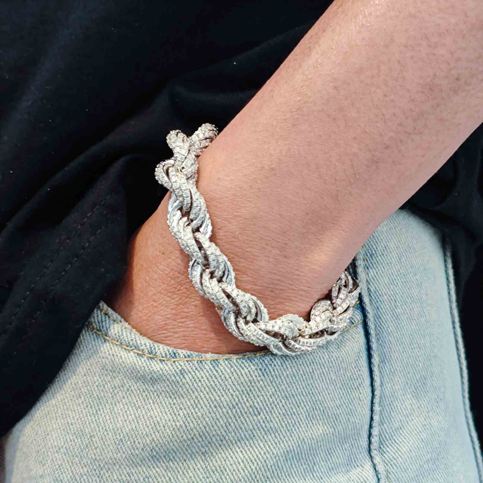 Edgy 12mm white gold rope bracelet on male wrist: Thick iced-out Moissanite links, secure ice-box clasp, and industrial hip-hop design. Passes diamond tester for authenticity.