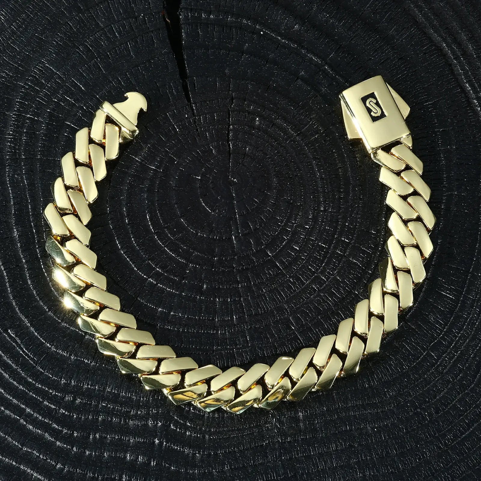 14K gold Monaco Cuban bracelet on black surface - 12mm EDGE plain lock clasp | Heavyweight luxury men's chain