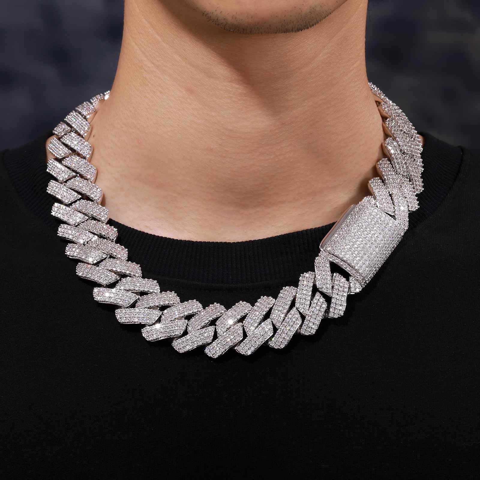 Male model rocking the 25mm gold Cuban Chain with a leather vest and grillz, embodying hip hop luxury for performances and street cred