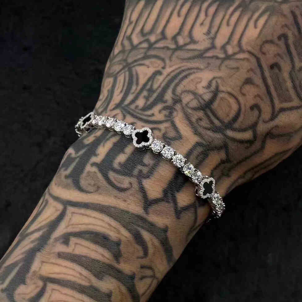 4mm 925 sterling silver moissanite tennis bracelet four leaf clover agate on tattooed arm — edgy styling, agate clover charm, moissanite brilliance, 925 silver craft