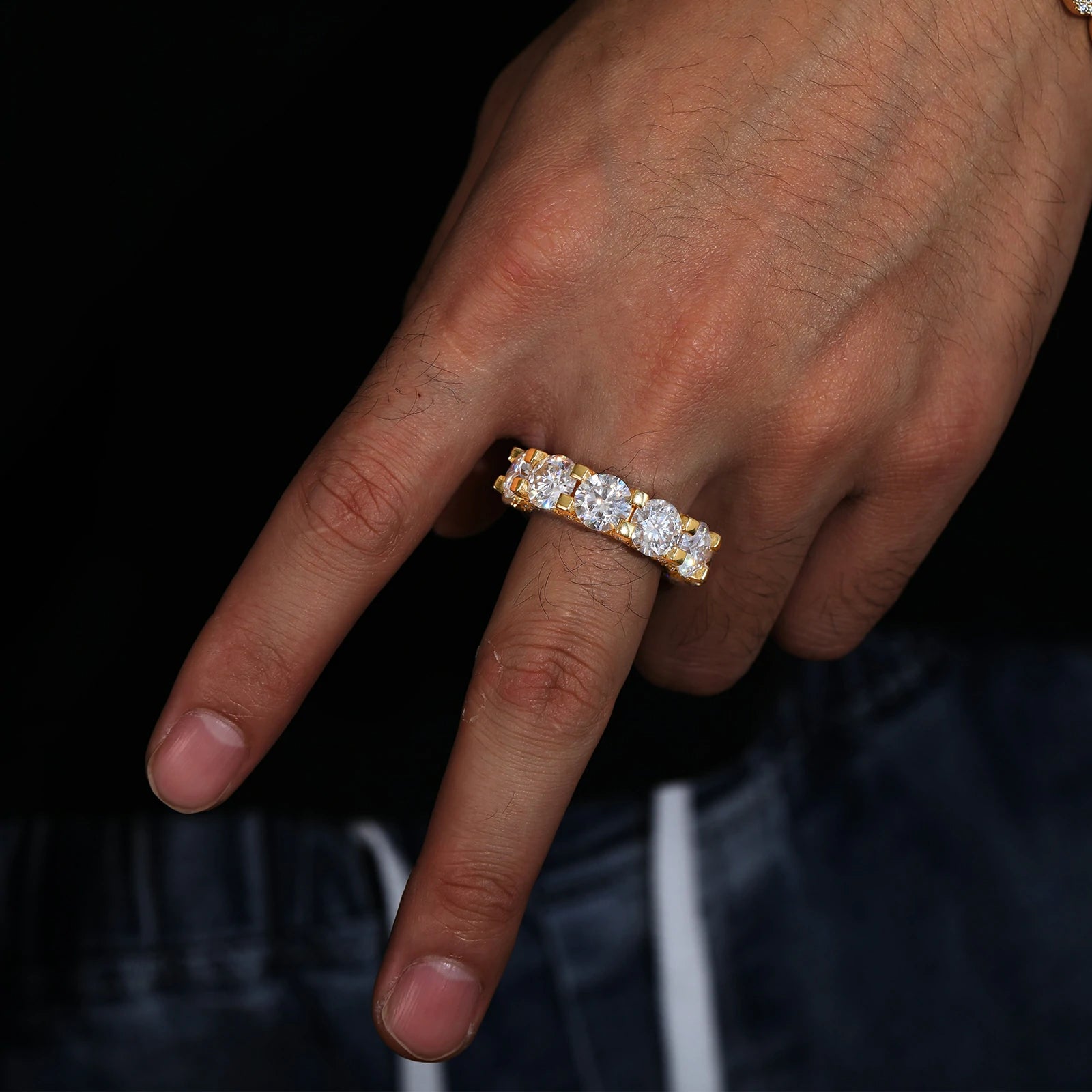 Elegant yellow gold moissanite cluster eternity ring worn by model, highlighting warm-toned luxury and 360° diamond-inspired brilliance.