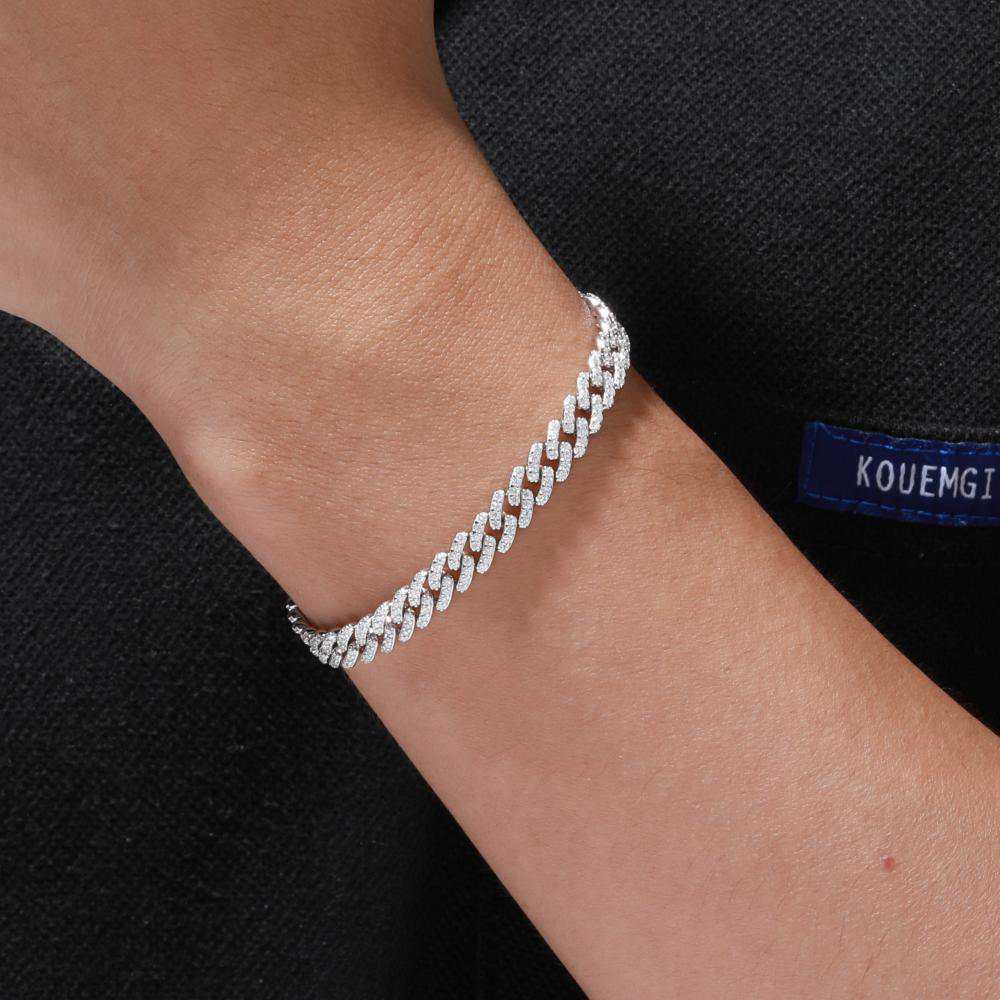 Men’s 6mm white gold S925 Moissanite Cuban link bracelet styled with streetwear, showcasing luxury hip-hop jewelry. Lab-grown DEF-grade Moissanite, 24K gold-plated (tarnish-proof)