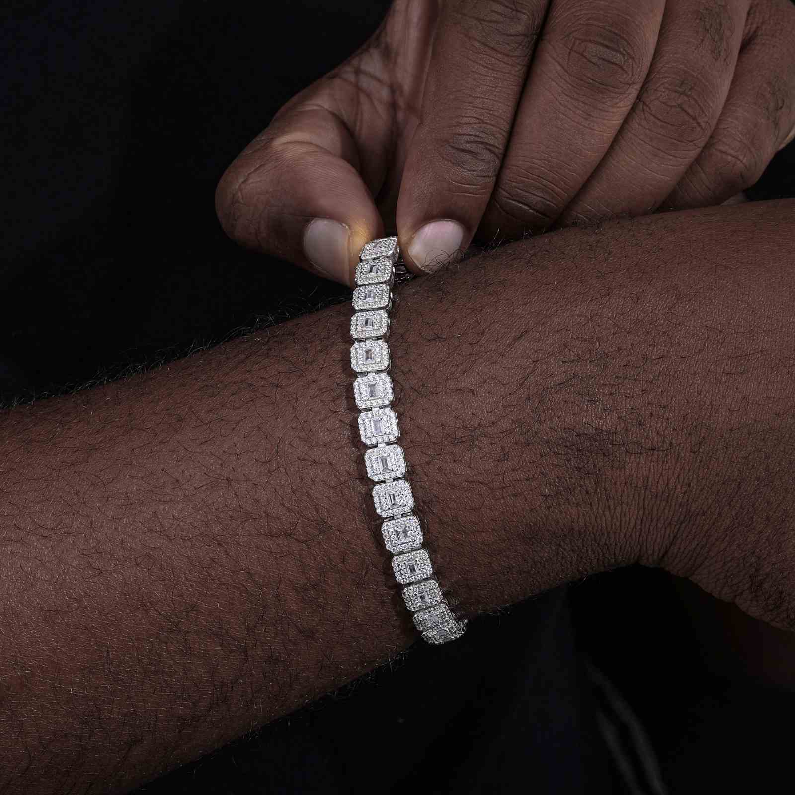 Close-up of white gold bracelet layered with titanium chain, emphasizing 7.5mm width for subtle yet impactful street luxe.