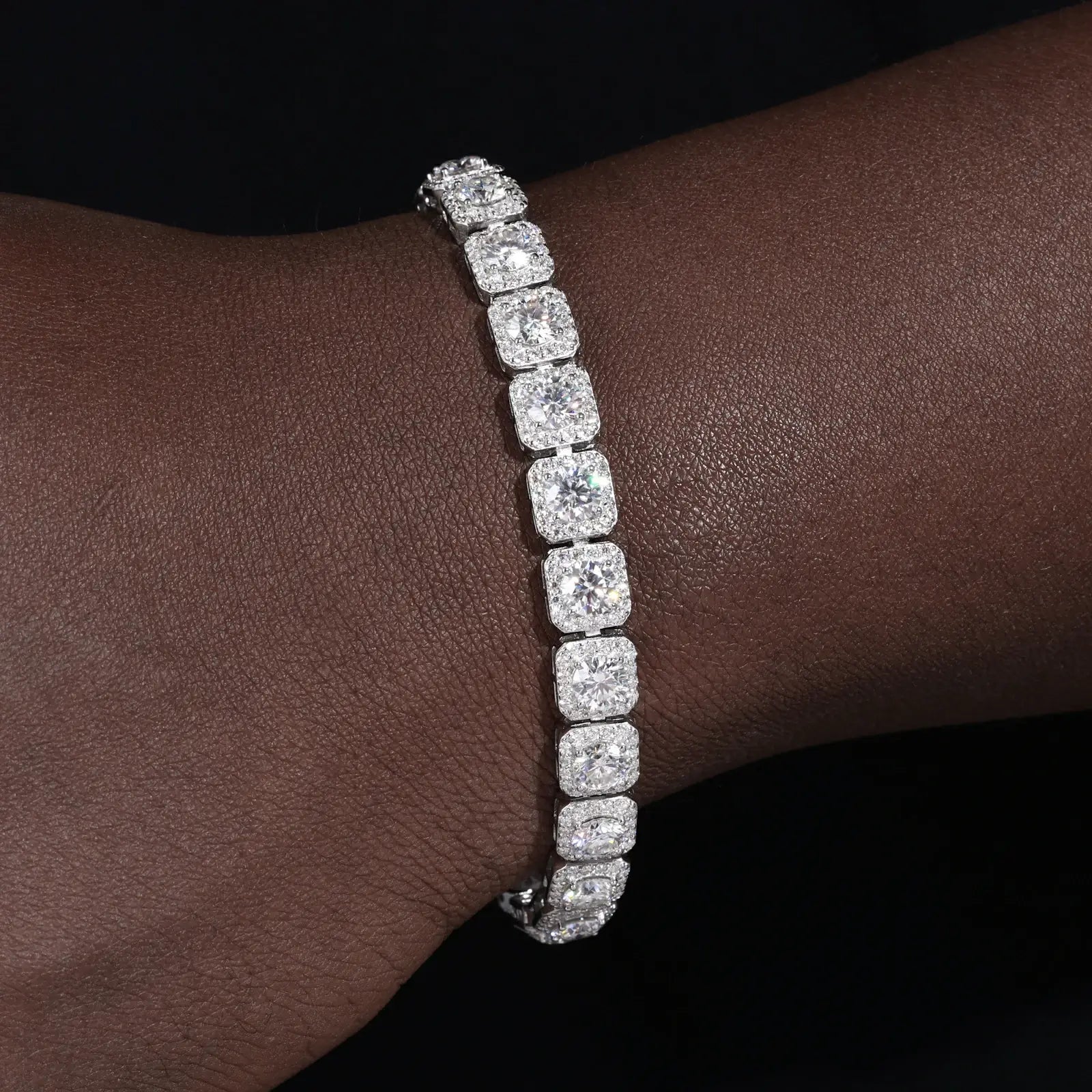 8mm 925 sterling silver moissanite clustered halo tennis bracelet on dark skin — everyday wearability, moissanite sparkle, 925 silver comfort, trendy clustered halo design