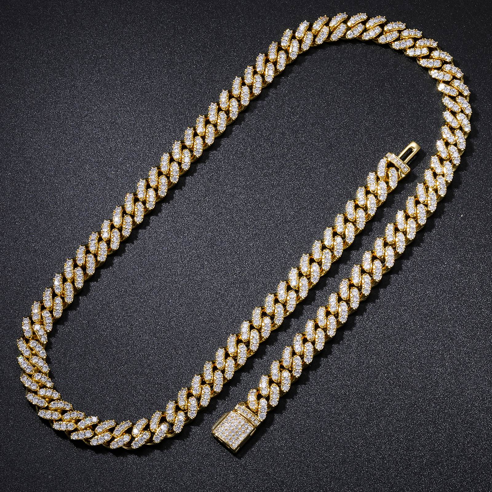 8mm Prong 1 Row CZ Diamond Cuban Link Chain in gold, laid flat on black velvet, showcasing minimalist hip hop luxury with single-row prong-set stones