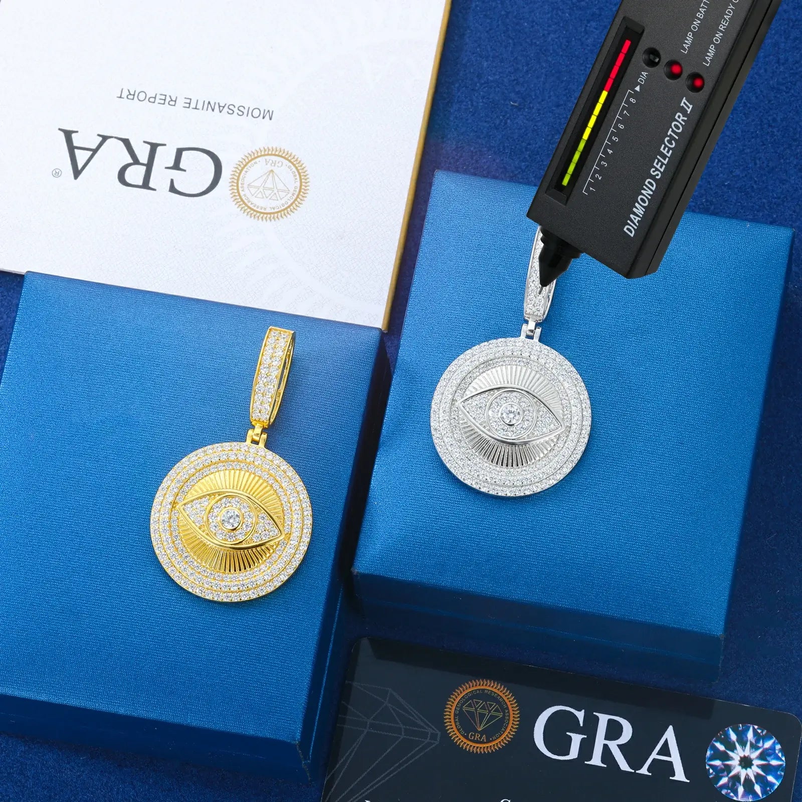 Yellow & white gold 925 sterling silver moissanite evil eye sun dog tag pendants with diamond tester + GRA certificate on blue table, certified moissanite jewelry