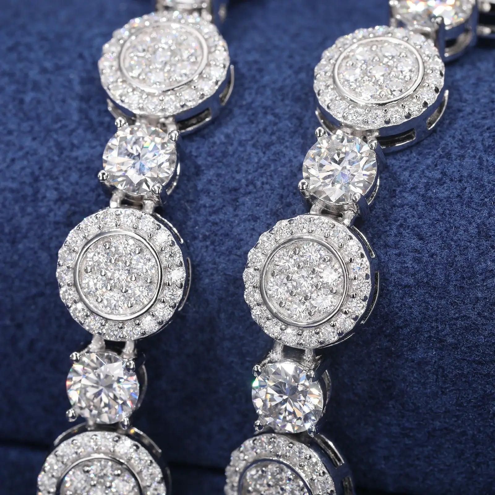 Macro close-up of 9mm white gold moissanite coin tennis chain - detailed coin links and premium stone setting on 925 sterling silver