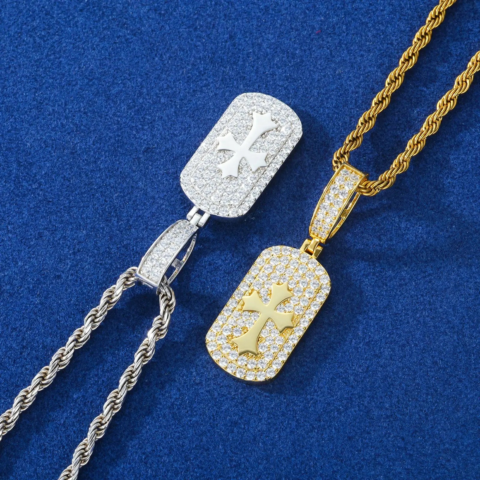 Close-up of yellow gold & white gold 925 sterling silver moissanite cross sign dog tag pendants on blue table — showcasing moissanite sparkle