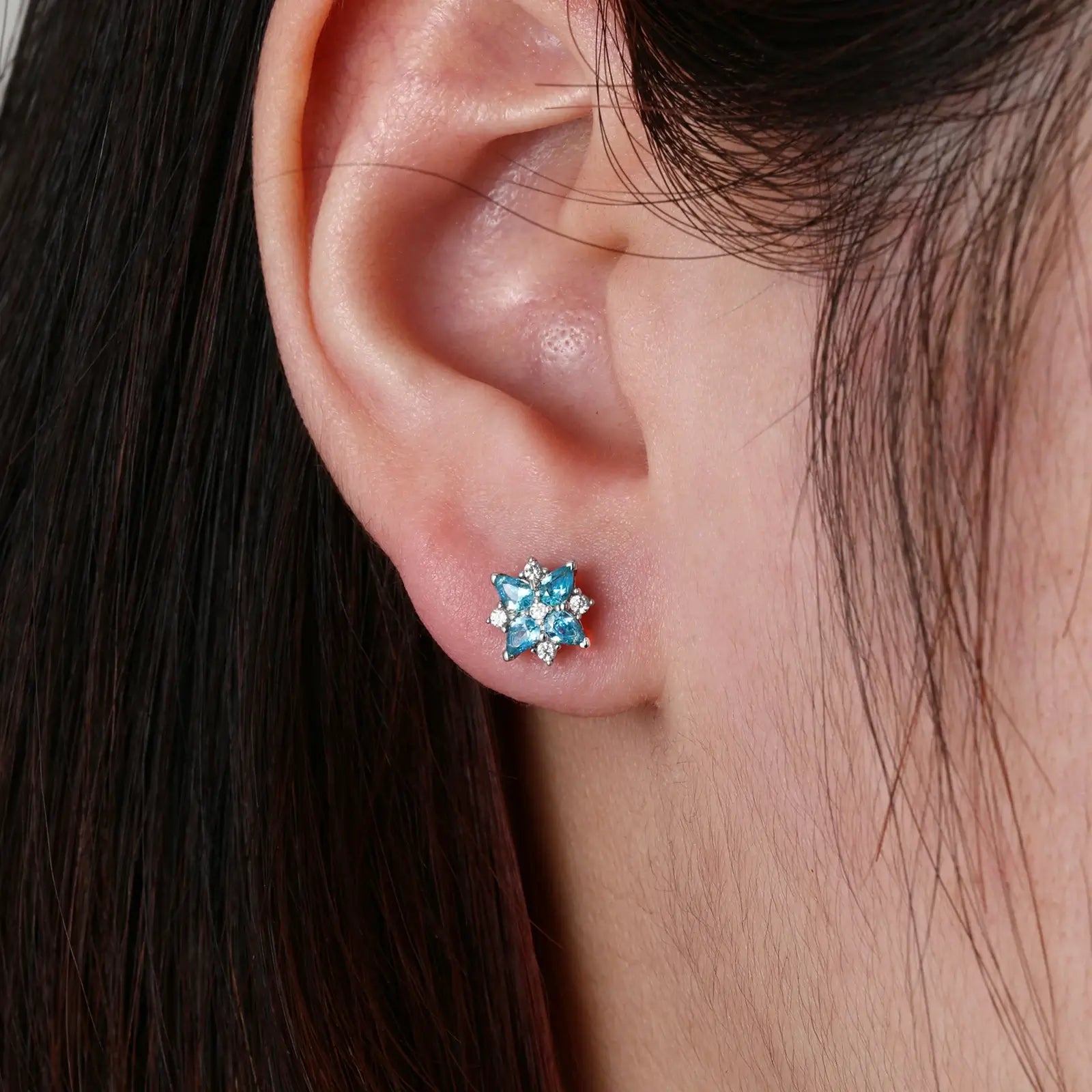 Female model wearing white gold 925 sterling silver moissanite lucky star clover stud earrings — tarnish-resistant 925 silver, sleek white gold tone, moissanite & zircon for elegant colorful glamour