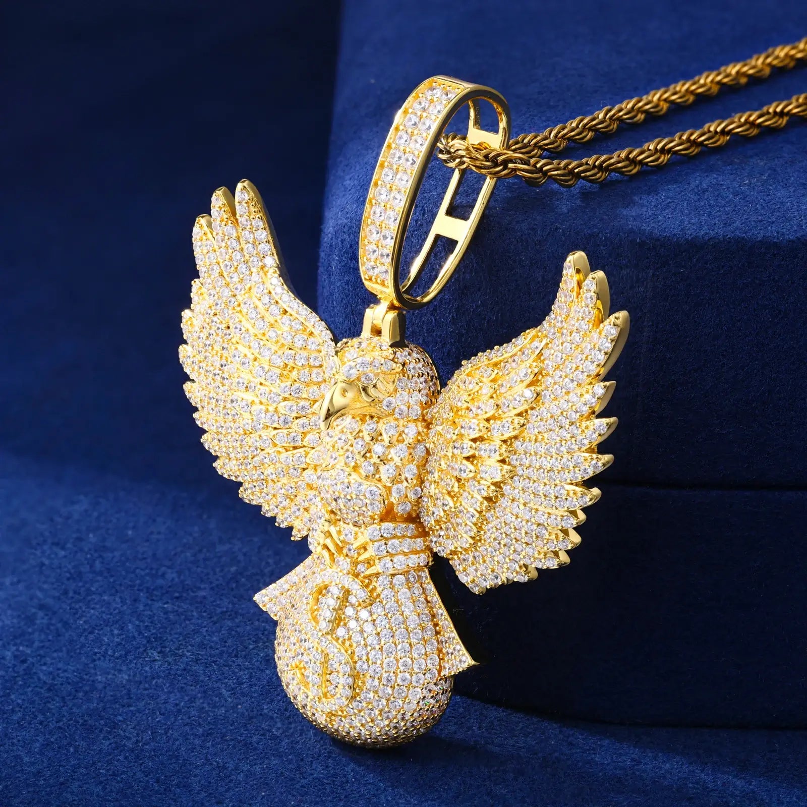 Gold 925 sterling silver moissanite bald eagle money bag pendant on blue velvet box — luxury packaging, hand-set moissanite, 925 silver longevity, hip-hop status symbol