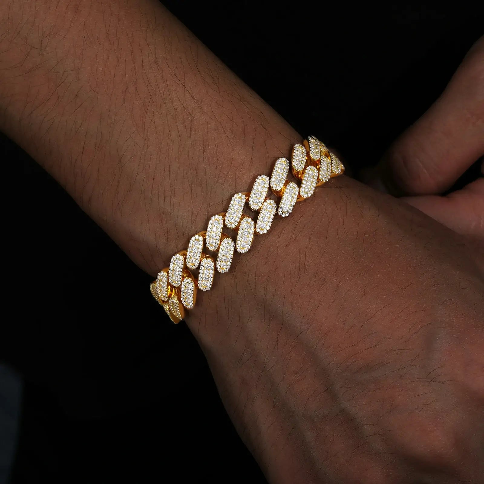 Male model rocking 12mm yellow gold 925 sterling silver 3 row moissanite Cuban link bracelet — trendy, hypoallergenic upscale bling