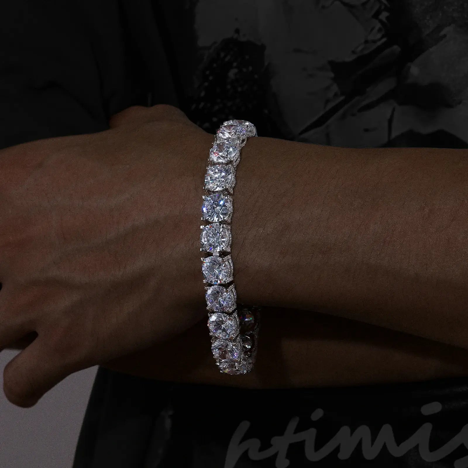Male model showcasing 10mm white gold 925 sterling silver moissanite iced out tennis bracelet — rust - proof streetwear bling accessory
