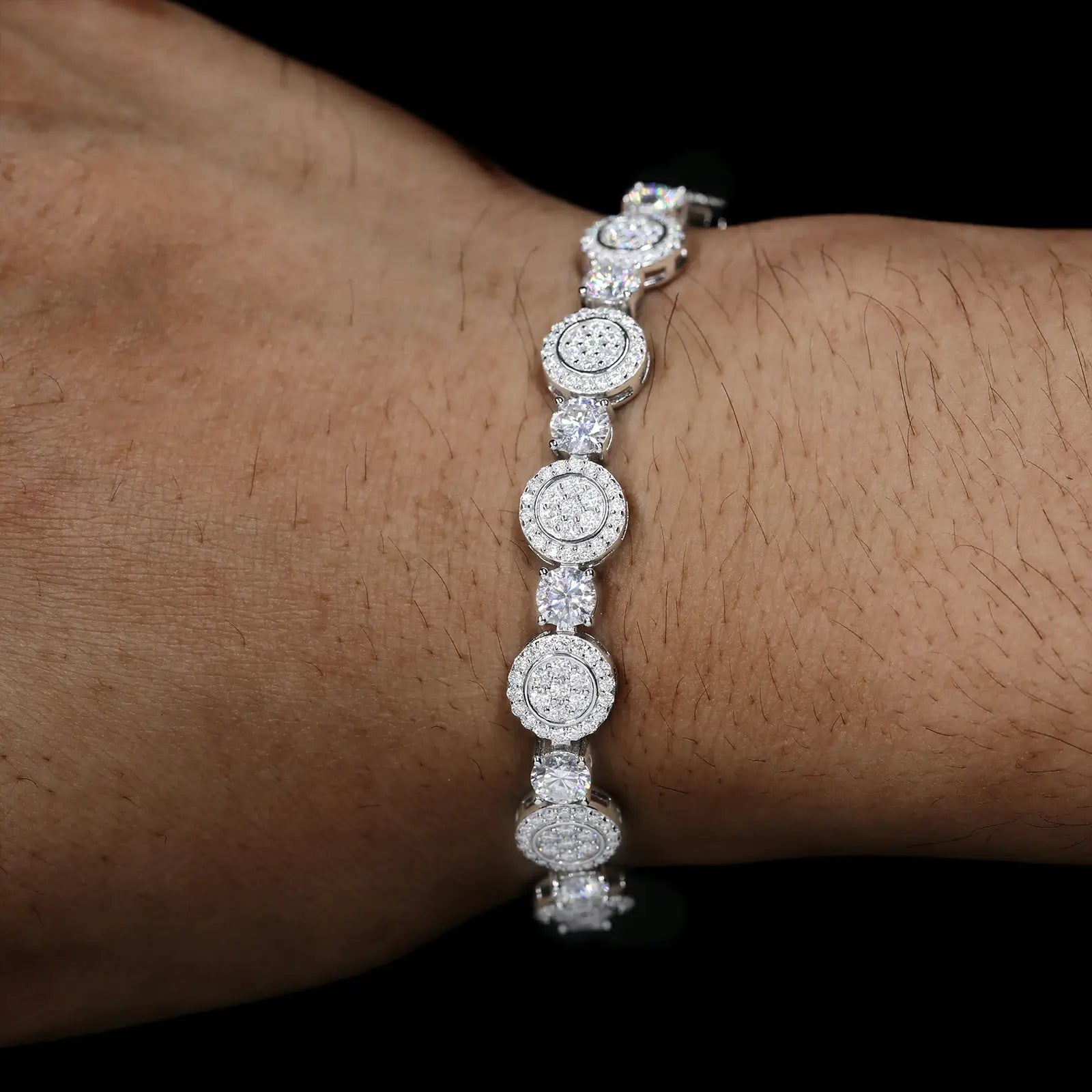 Male model wearing 9mm white gold 925 sterling silver moissanite concentric circles tennis bracelet — hypoallergenic, waterproof luxury hip-hop jewelry