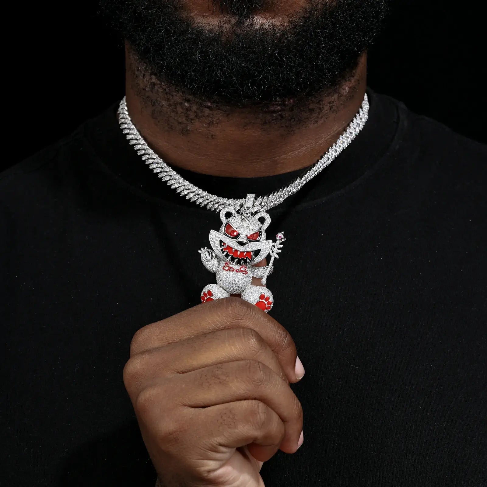 Male model styling white gold 925 sterling silver moissanite evil bear pendant with Cuban link — bold hip-hop style, moissanite brilliance