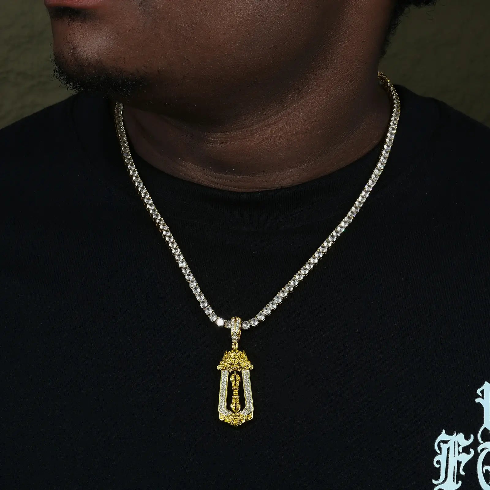 Male model wearing yellow gold 925 sterling silver moissanite brave troops vajra pendant with tennis chain — moissanite sparkle, vajra design, hypoallergenic 925 silver