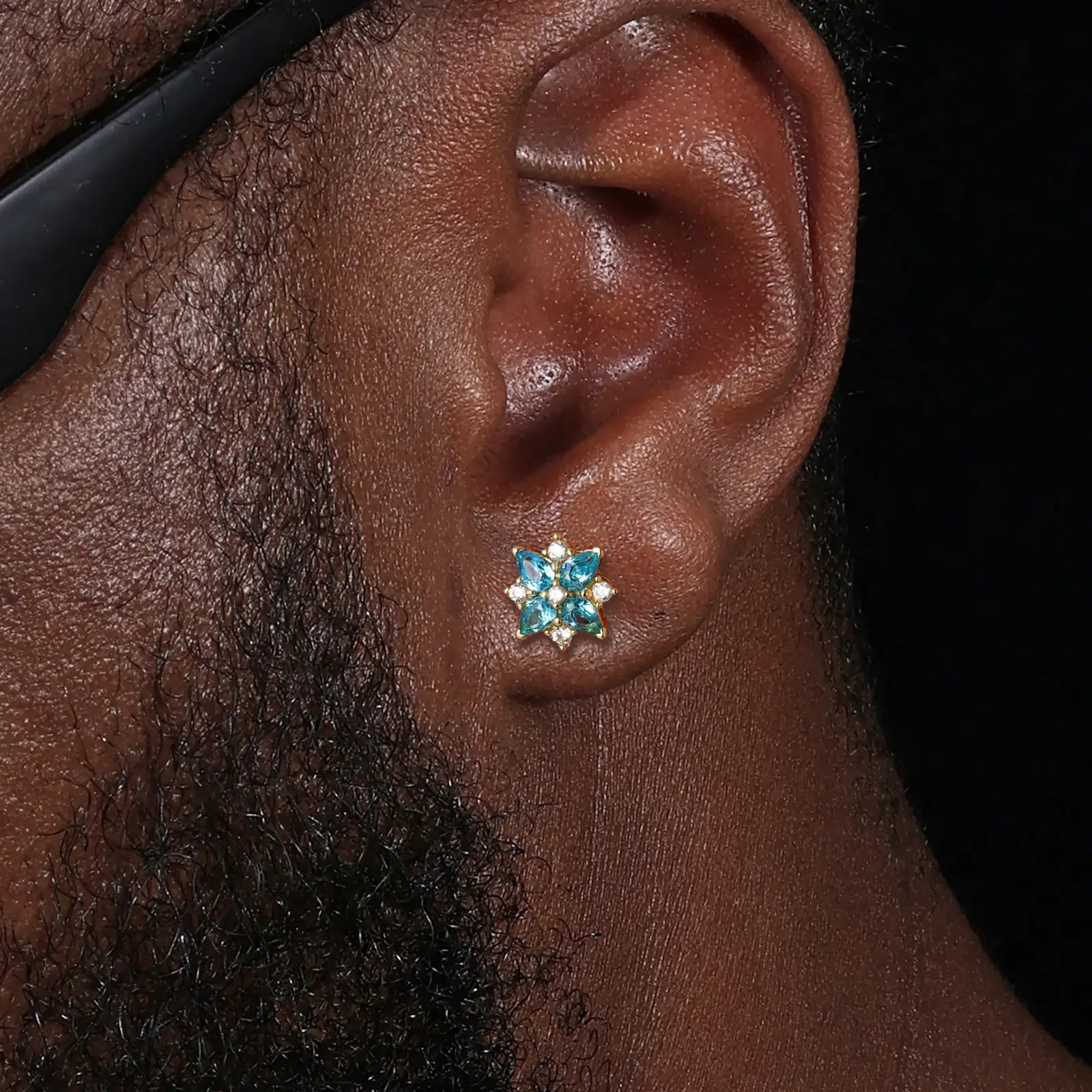 Male model wearing yellow gold 925 sterling silver moissanite lucky star clover stud earrings — hypoallergenic 925 silver, bold star-clover motif, moissanite & zircon detail for edgy daily style