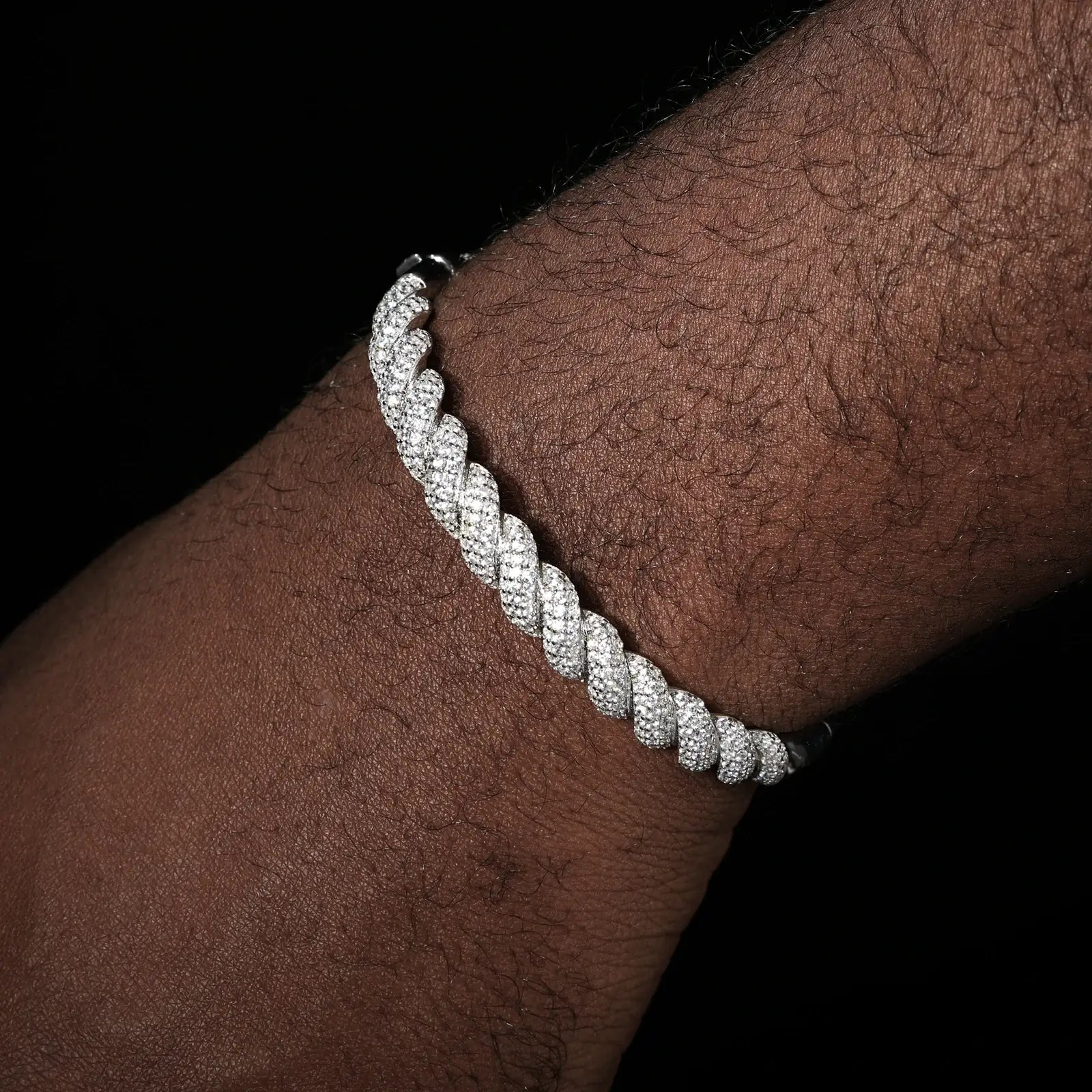 Male model showcasing 8mm white gold 925 silver moissanite twisted bangle — hypoallergenic, diamond-like sparkle for daily luxury wear