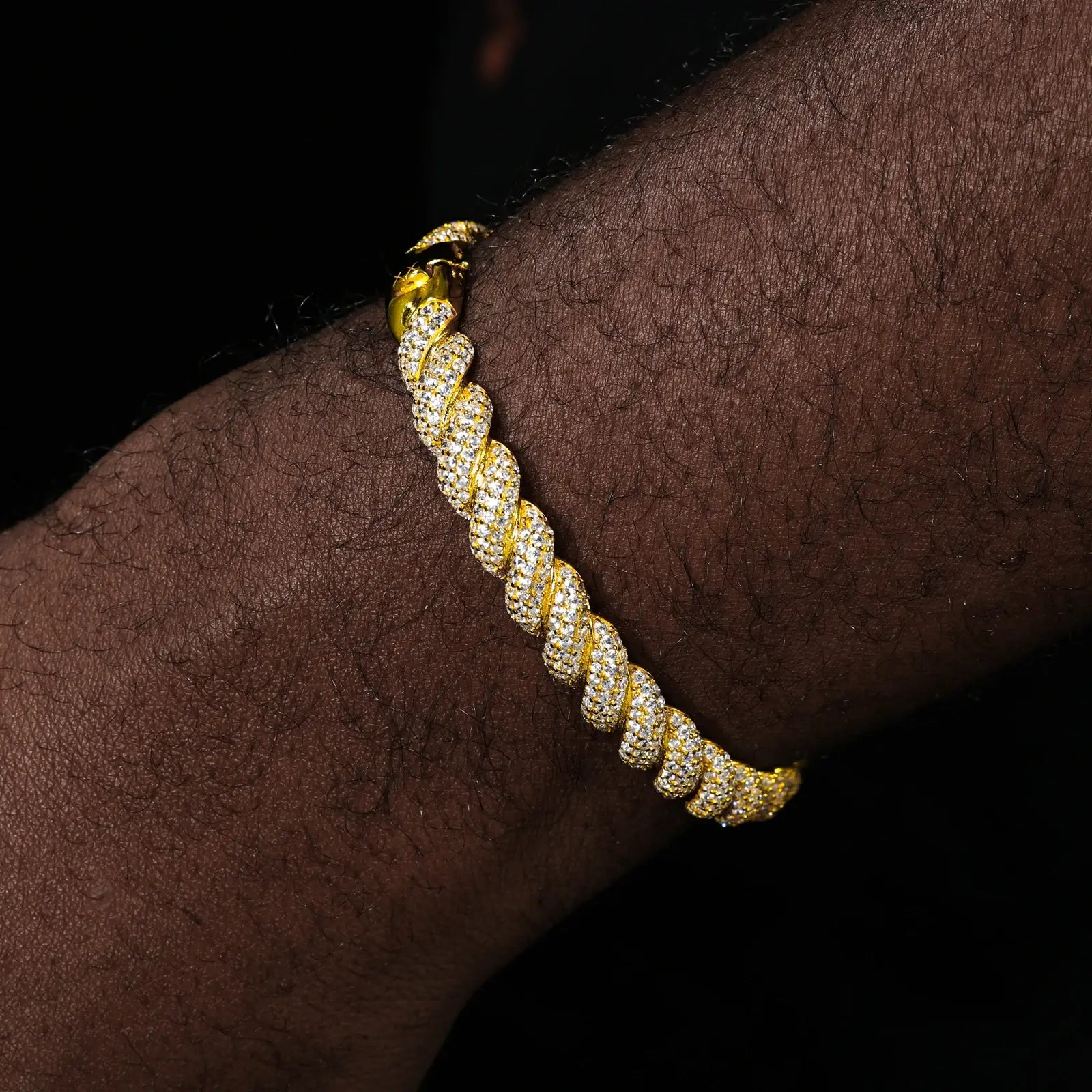 Male model wearing 8mm yellow gold 925 silver moissanite twisted bangle — tarnish-resistant, bold moissanite glow for trendsetters