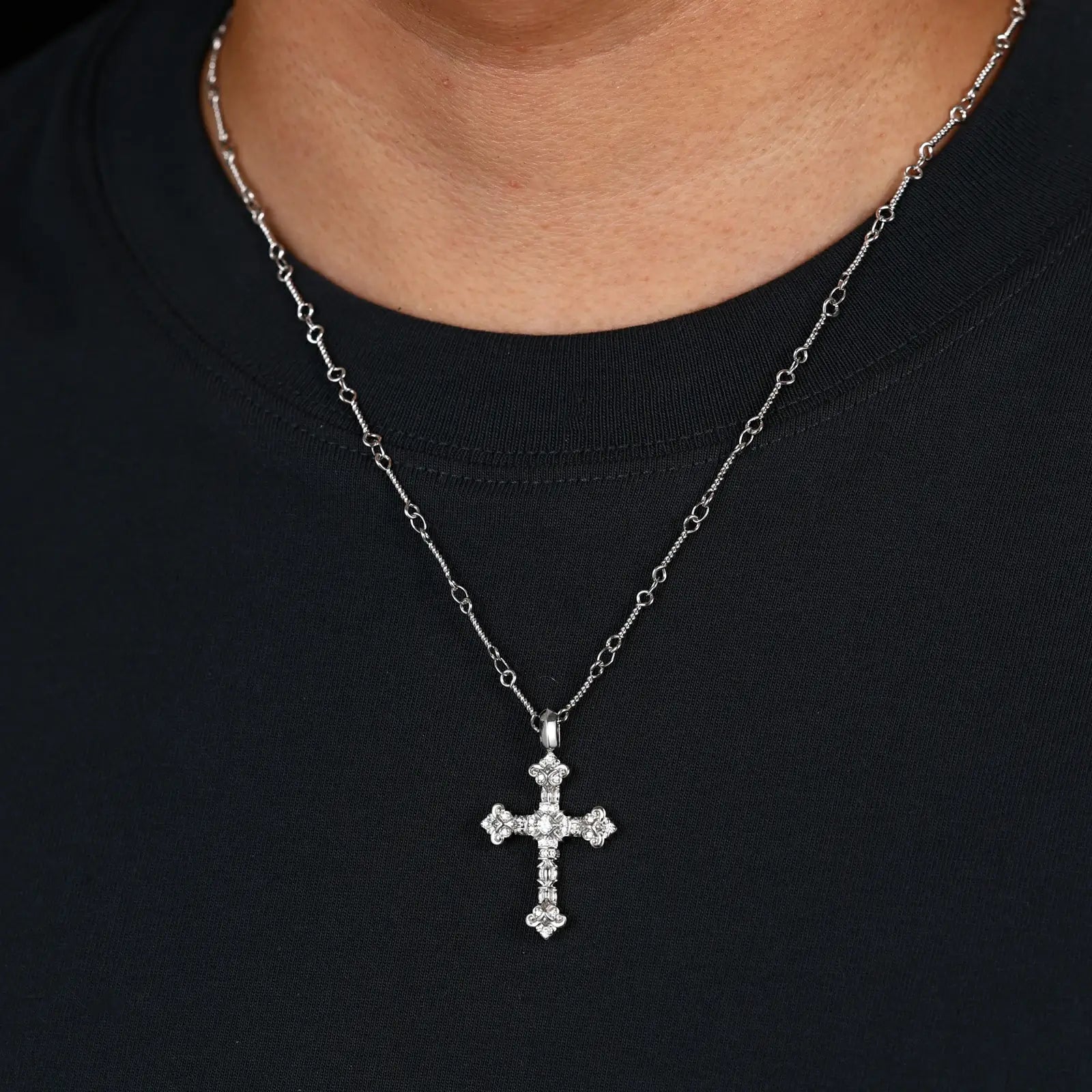 Male model wearing S925 moissanite flame cross pendant (white gold), men’s luxury faith-inspired jewelry, hypoallergenic 925 silver base