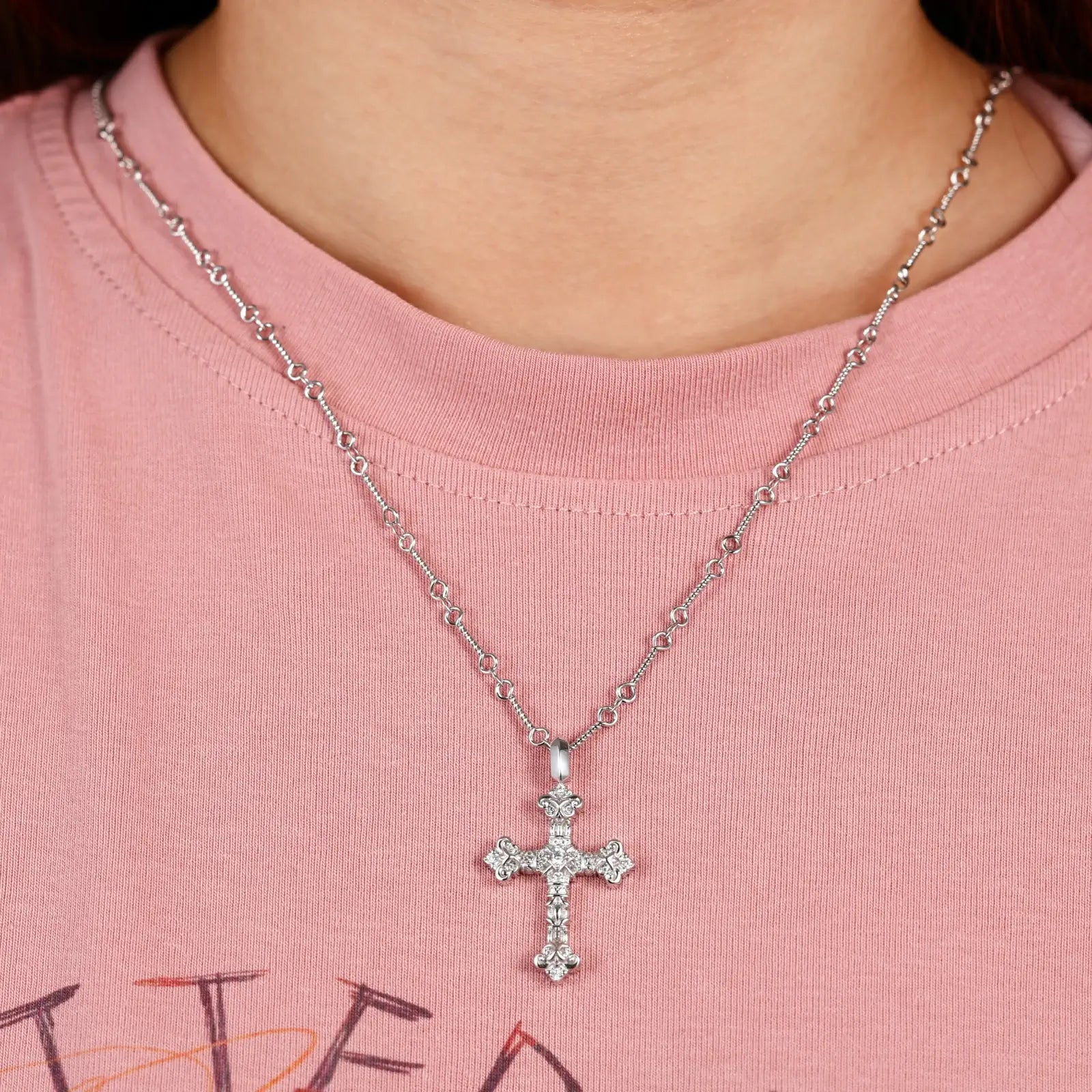 Female model wearing S925 moissanite flame cross pendant (yellow gold), women’s trendy religious jewelry, brilliant moissanite stone