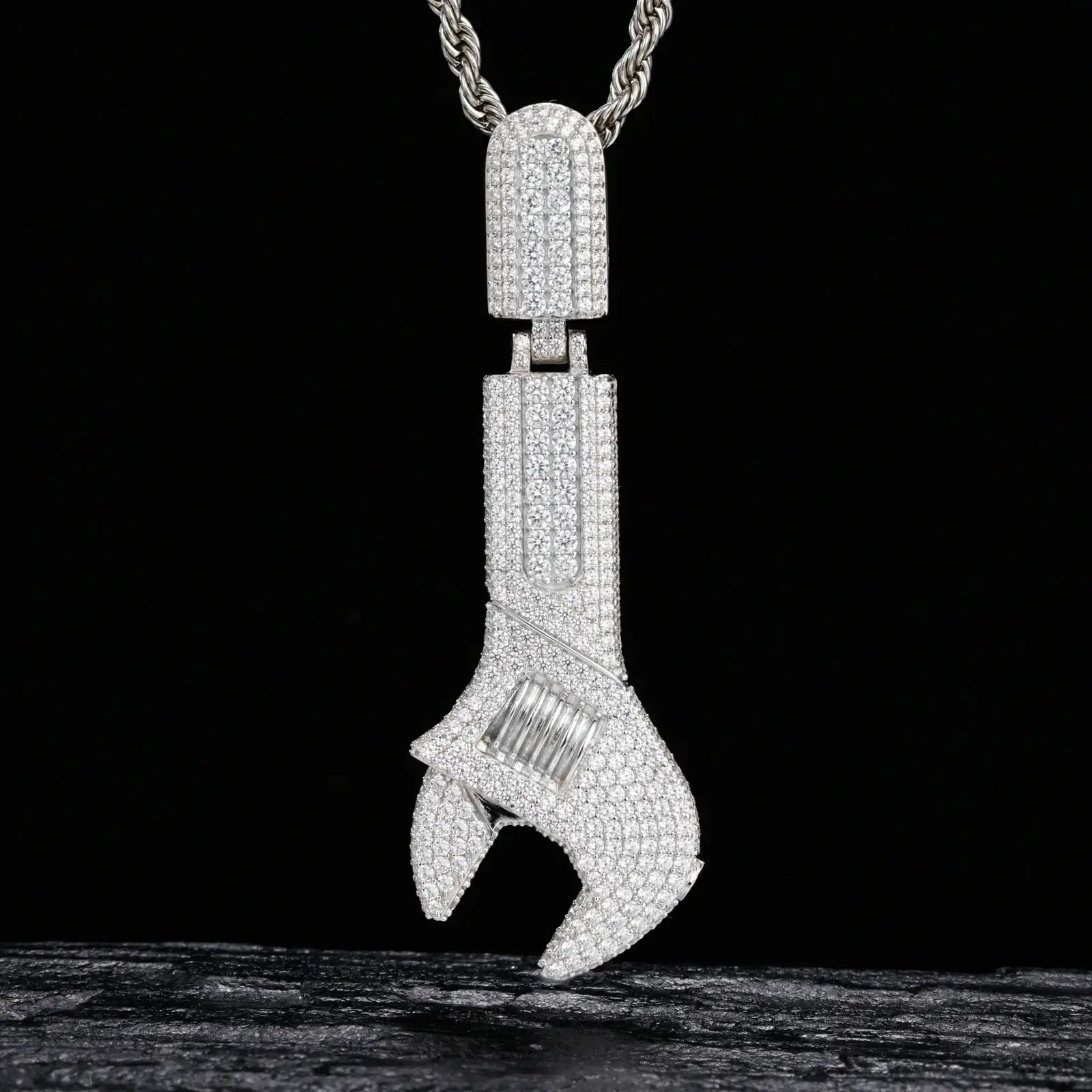 Silver 925 sterling silver moissanite wrench pendant on black texture background — iced-out moissanite, industrial-chic silhouette, 925 silver durability, streetwear luxury