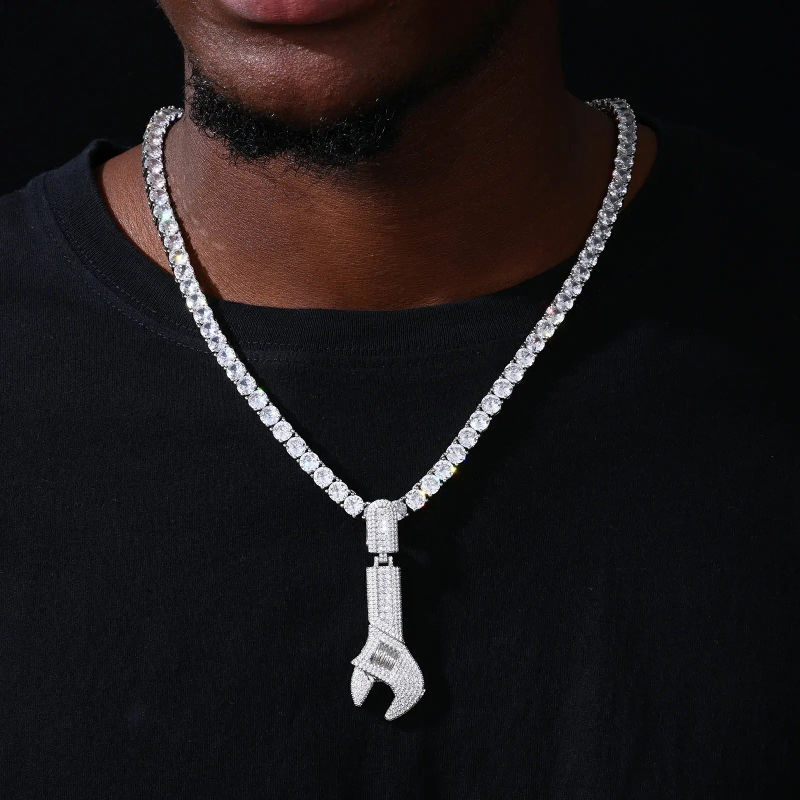 Silver 925 sterling silver moissanite wrench pendant worn on black outfit — everyday hip-hop styling, moissanite brilliance, 925 silver comfort, industrial-chic accessory