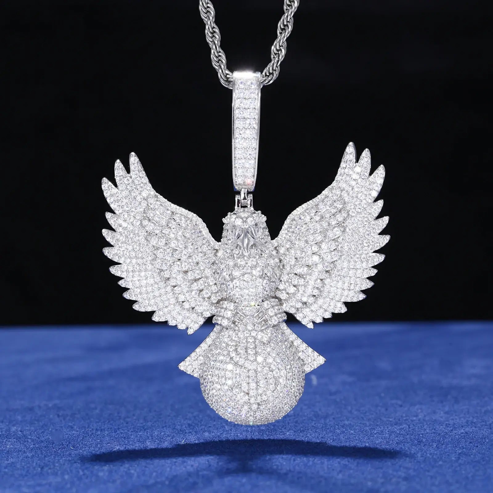 Silver 925 sterling silver moissanite bald eagle grabs money bag pendant on blue background — intricate feather detail, moissanite fire, 925 silver durability, streetwear statement