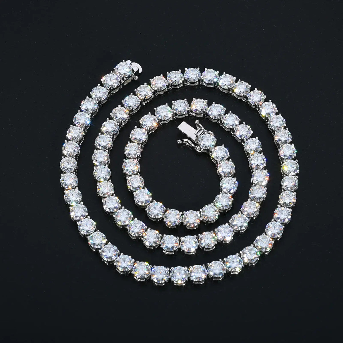White gold 925 sterling silver cluster moissanite tennis chain on black background — highlights diamond-like moissanite, cluster detailing, tarnish-resistant 925 silver, iced-out trend