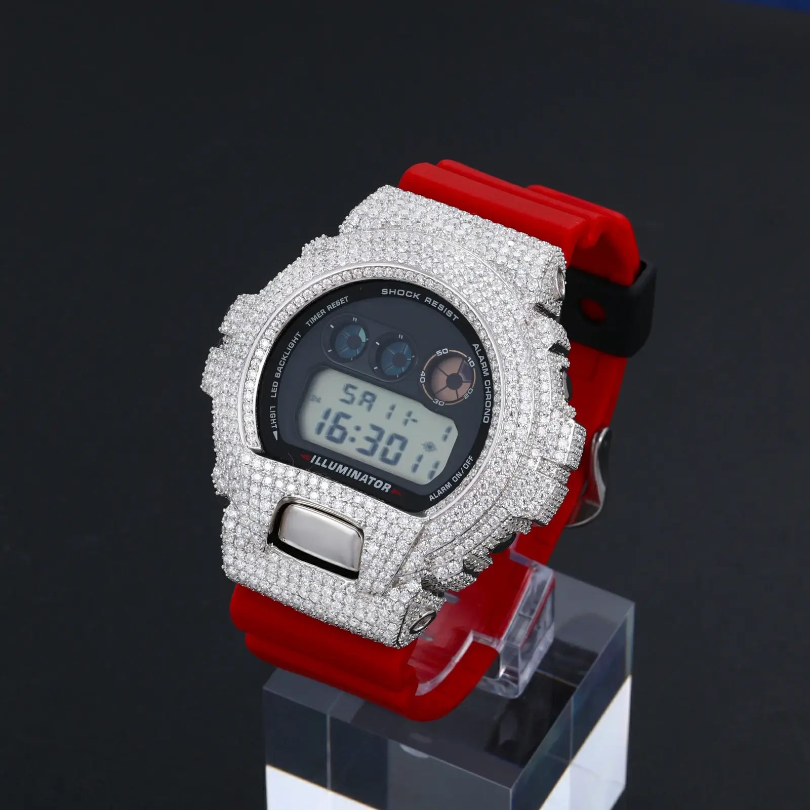 White gold 925 sterling silver moissanite G-Shock DW6900 watch case installed on red band watch — shows real-world application, iced-out retro-tech style, durable moissanite