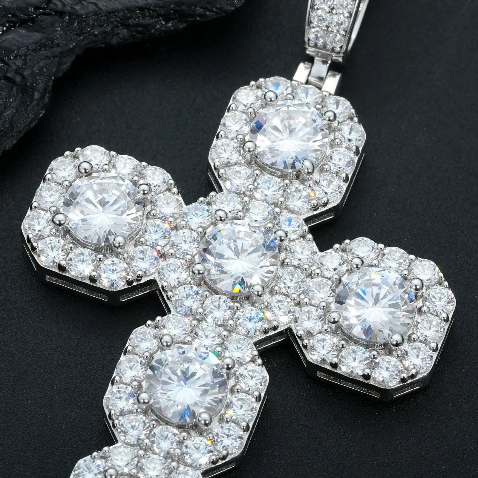 Close-up front display of white gold 925 sterling silver moissanite square halo cross pendant against black table — highlighting moissanite halos, 925 silver finish, intricate cross detail