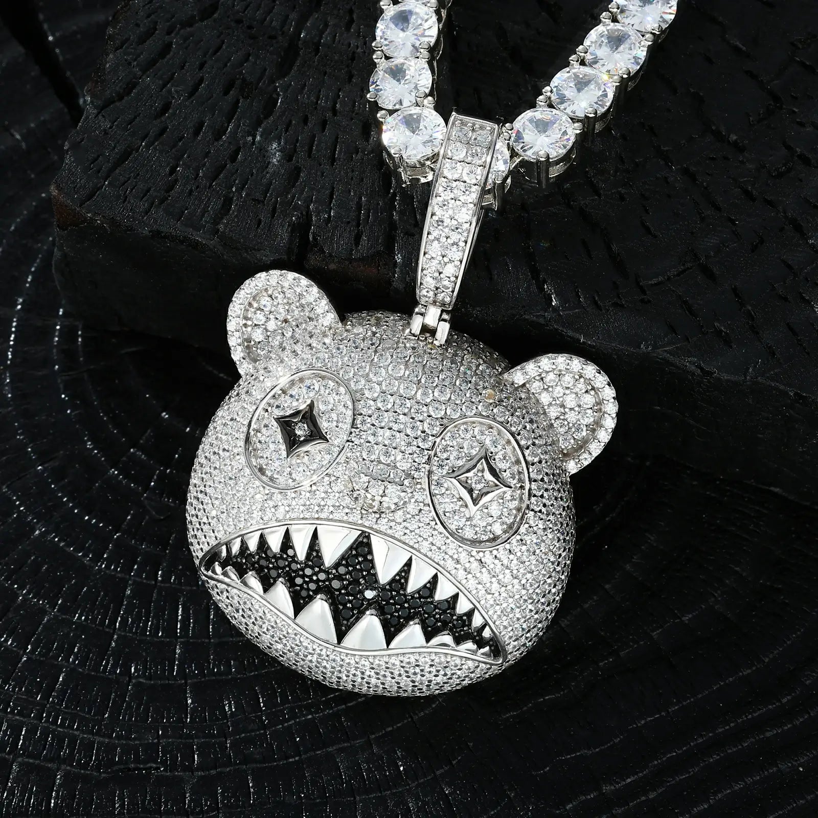 Side view of yellow gold 925 sterling silver moissanite hungry bear pendant on black table — highlighting toothy grin, gem details