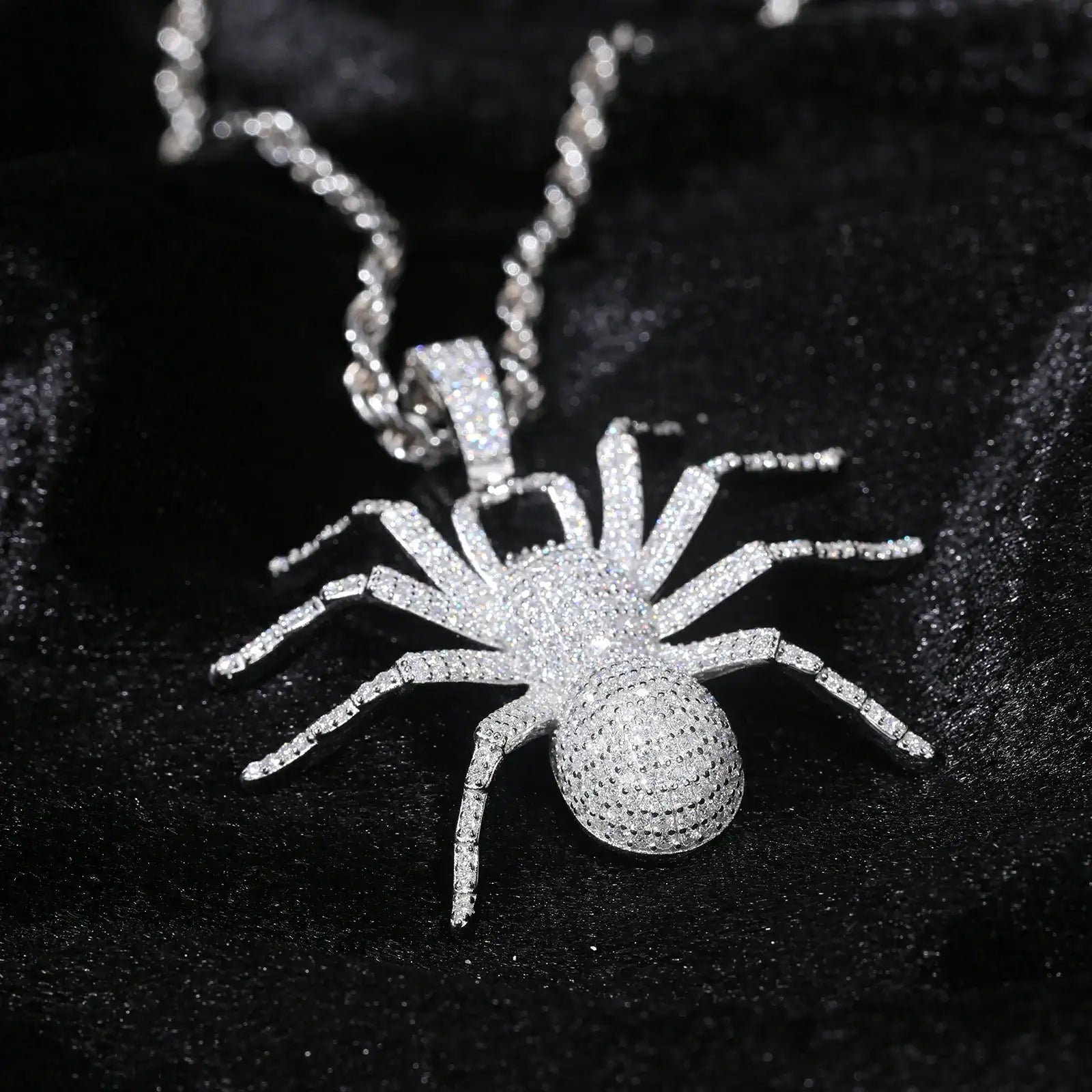 Close-up of yellow gold 925 sterling silver moissanite spider pendant on black table — highlighting moissanite detailing, spider anatomy