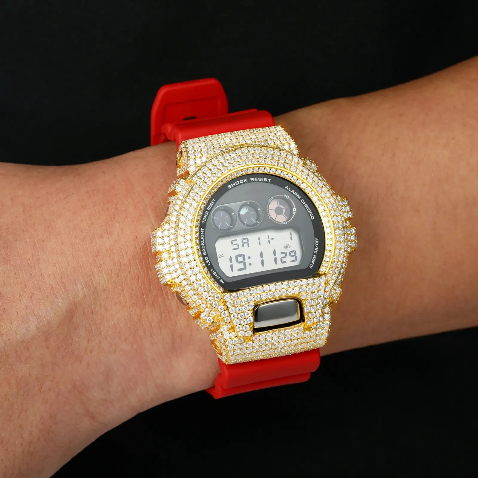 Model wearing yellow gold 925 sterling silver moissanite G-Shock DW6900 watch case on red band — showcases streetwear luxury, hypoallergenic 925 silver, everyday wearability