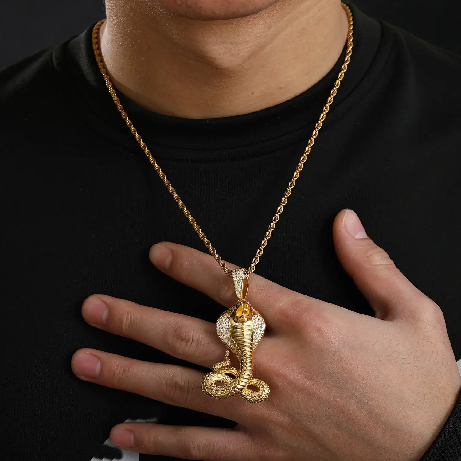 African American man styling 14K gold cobra pendant - diamond-like moissanite scales | Hypoallergenic S925 spiritual armor
