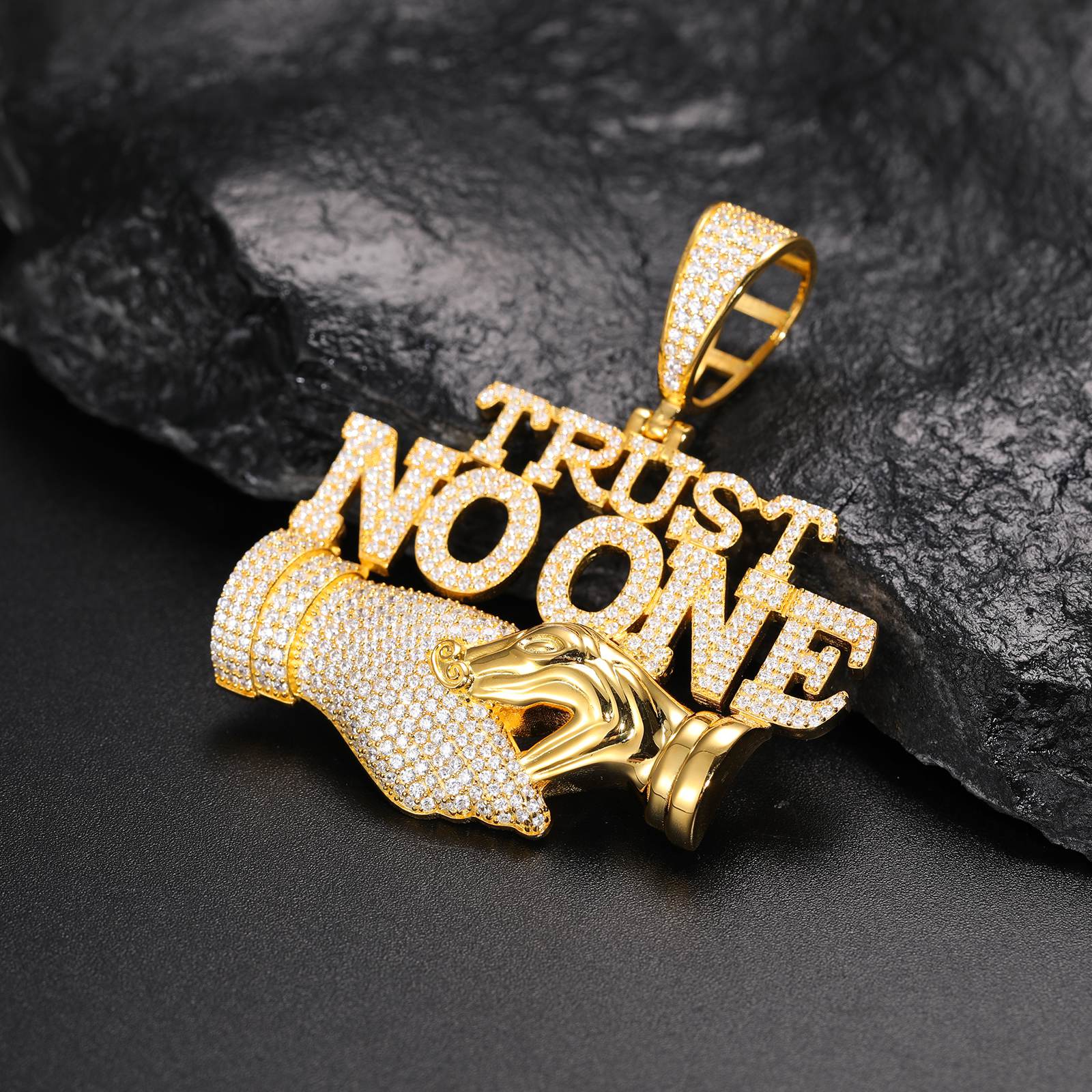 Art-directed 45° view: "TRUST NO ONE" pendant on marble - moissanite-encrusted trap design | ISO 9227 corrosion-proof