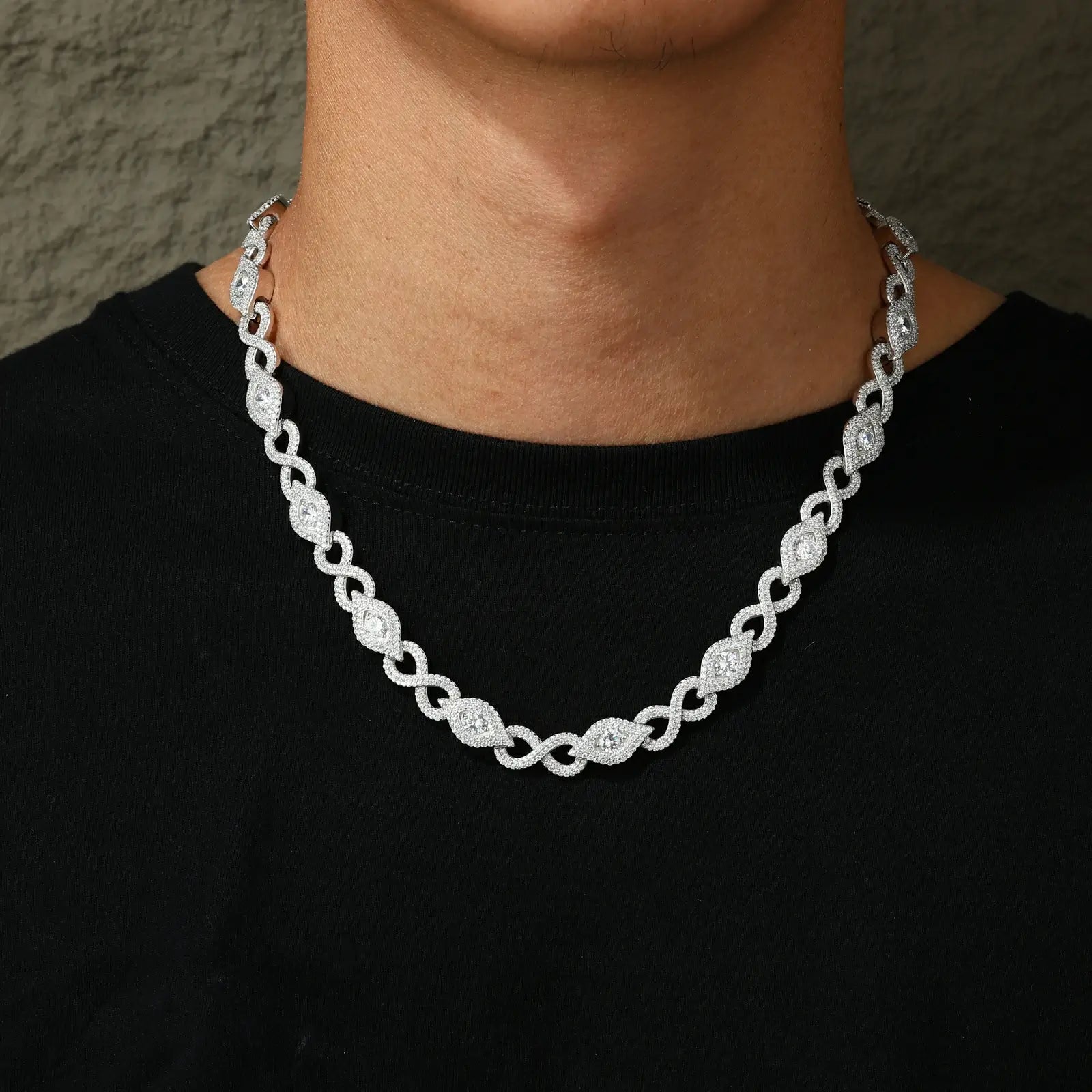 African American man modeling 10mm S925 white gold plated Evil Eye chain - diamond-cut moissanite links contrasting dark skin for urban luxury style