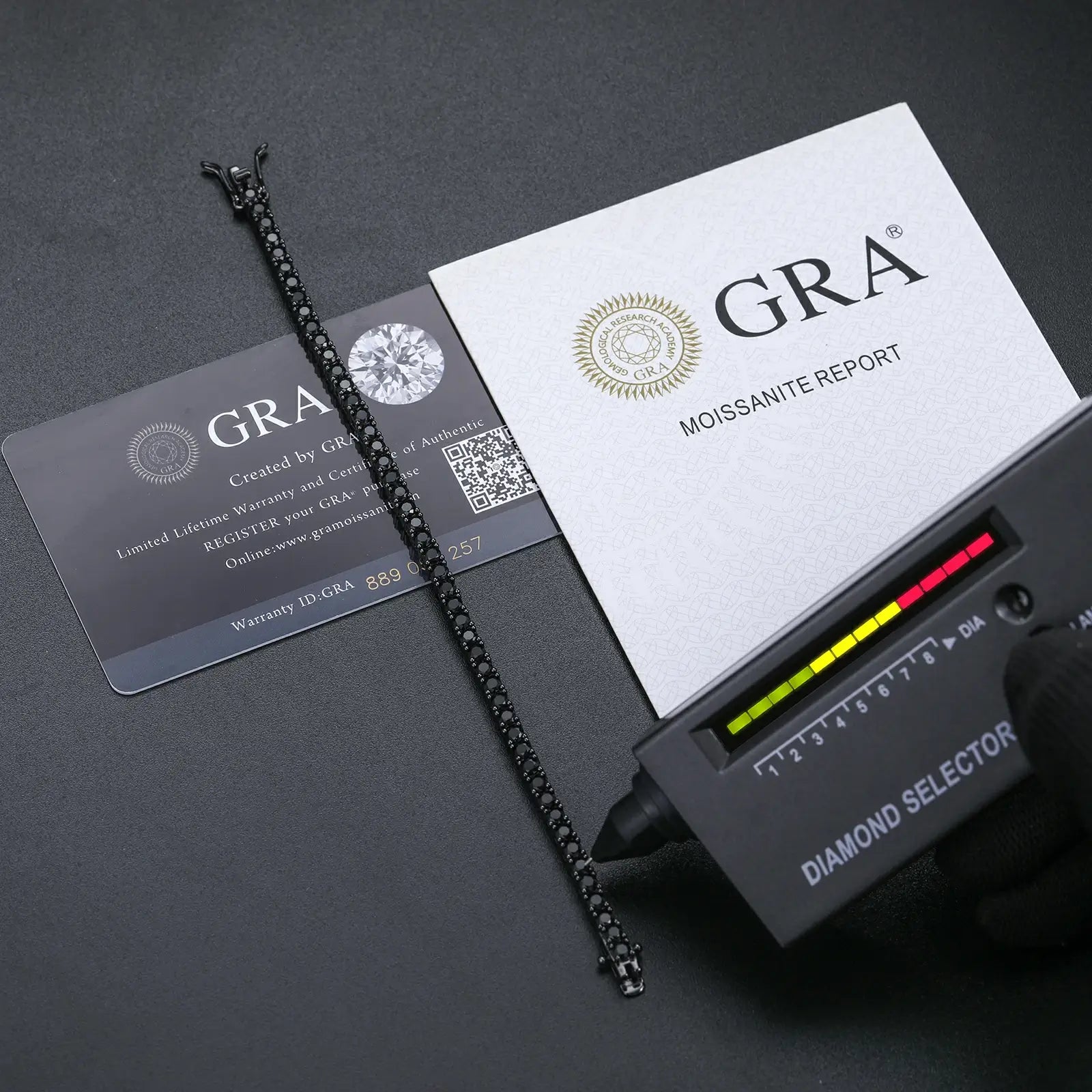 Diamond tester and GRA certificate verifying 3mm black moissanite tennis bracelet authenticity, ensuring genuine quality and brilliance