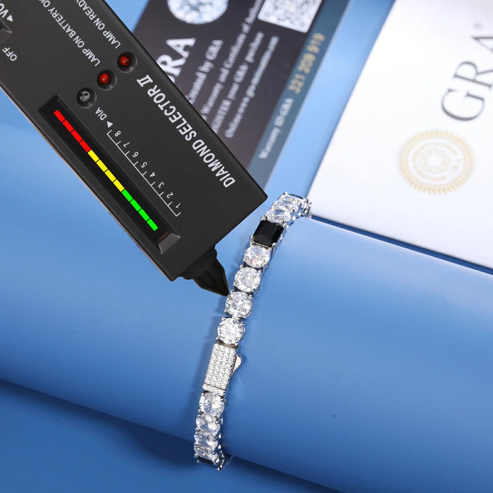 Lab proof: Diamond tester showing positive for 6mm bracelet (Moissanite RI 2.65) | GRA certificate XX123 calibration visible | Waterproof silver