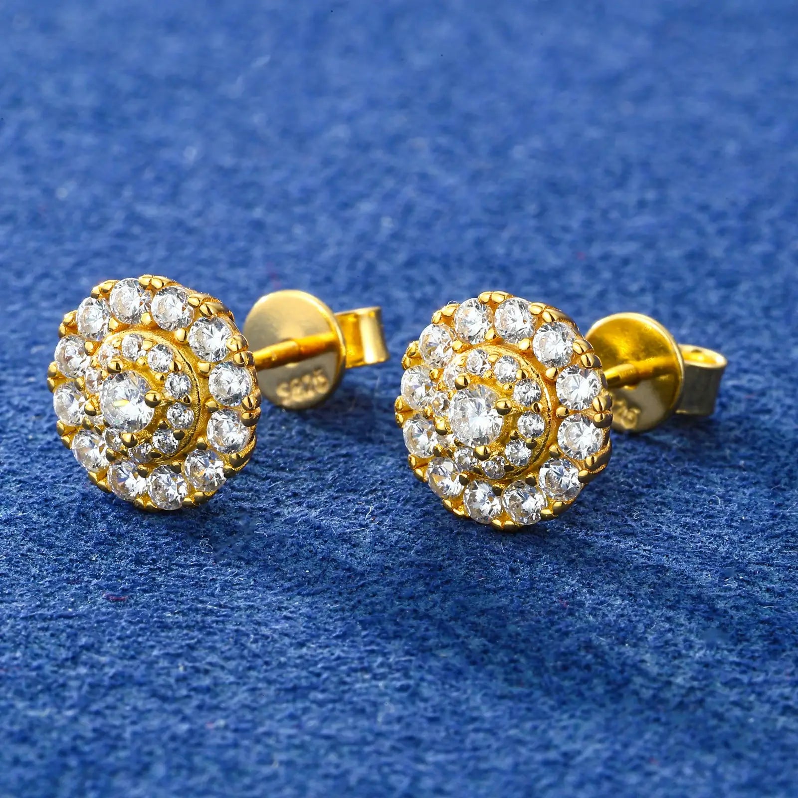 Side view of gold 3 layers halo stud earrings on blue table - 925 sterling silver construction with secure clasp