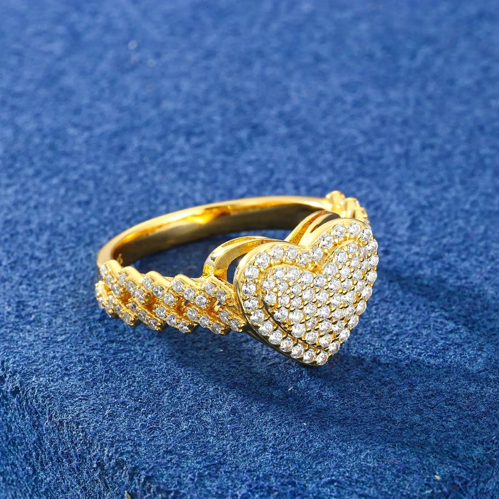 Profile shot: Gold heart ring with Cuban links on blue table - angled to show 2-layer construction | Tarnish-resistant jewelry