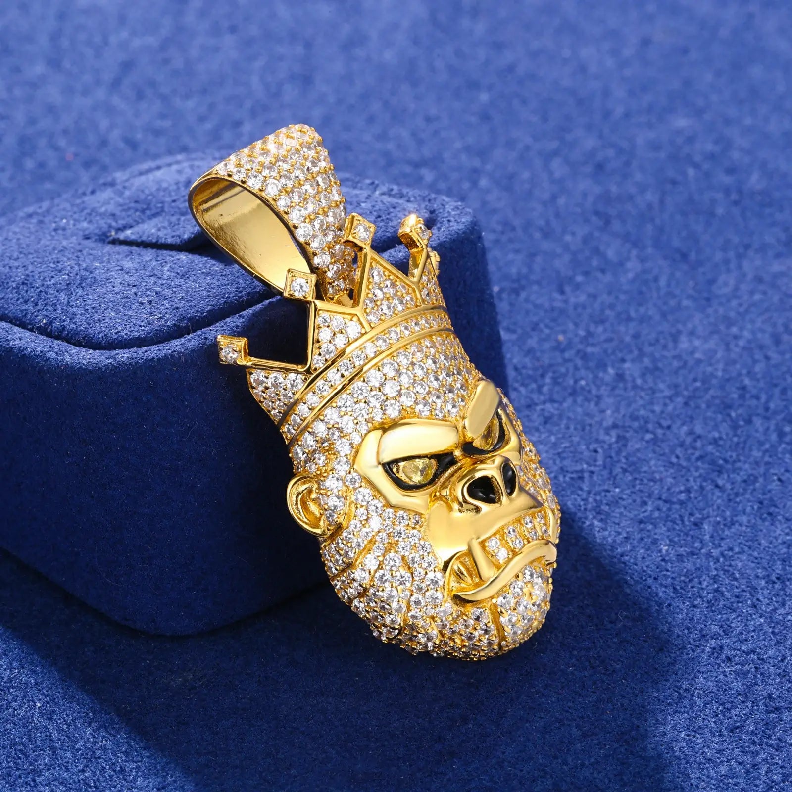 Side view of gold gorilla king pendant on blue table - showing 3D construction and detailed moissanite pave setting