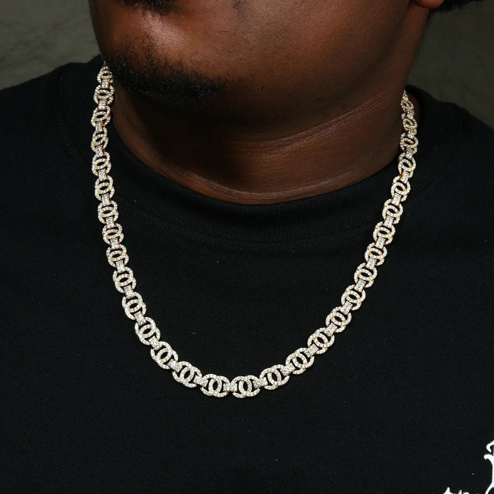 African American man wearing gold plated S925 moissanite chain - 10mm yellow gold finish Cuban links for high-end hip-hop jewelry