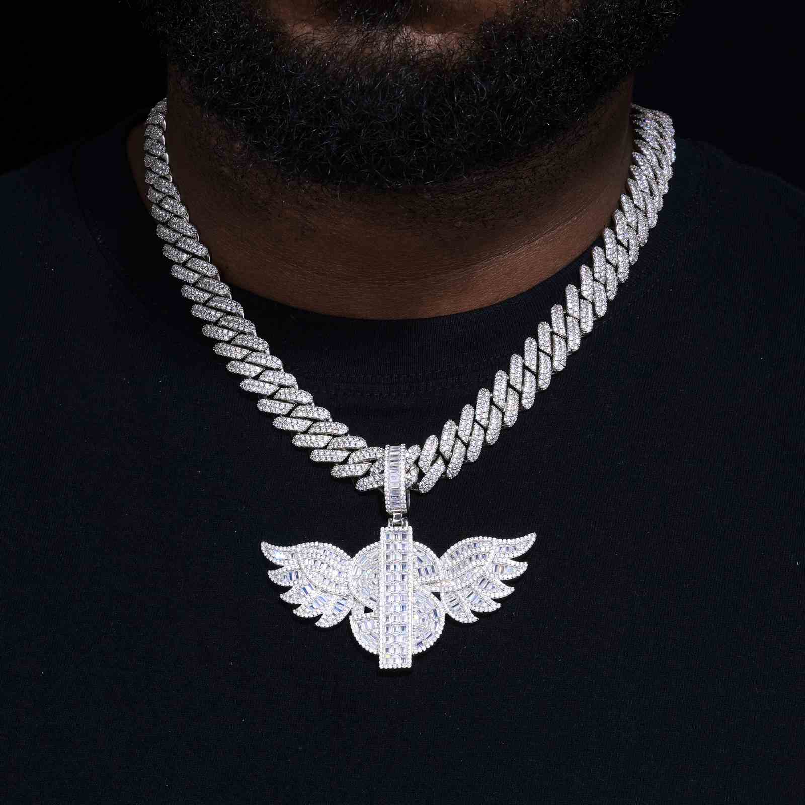 African American male model wearing S925 gold-plated USD wing pendant necklace in hip hop style, bold 3D wing design with VVS moissanite stones under concert lighting