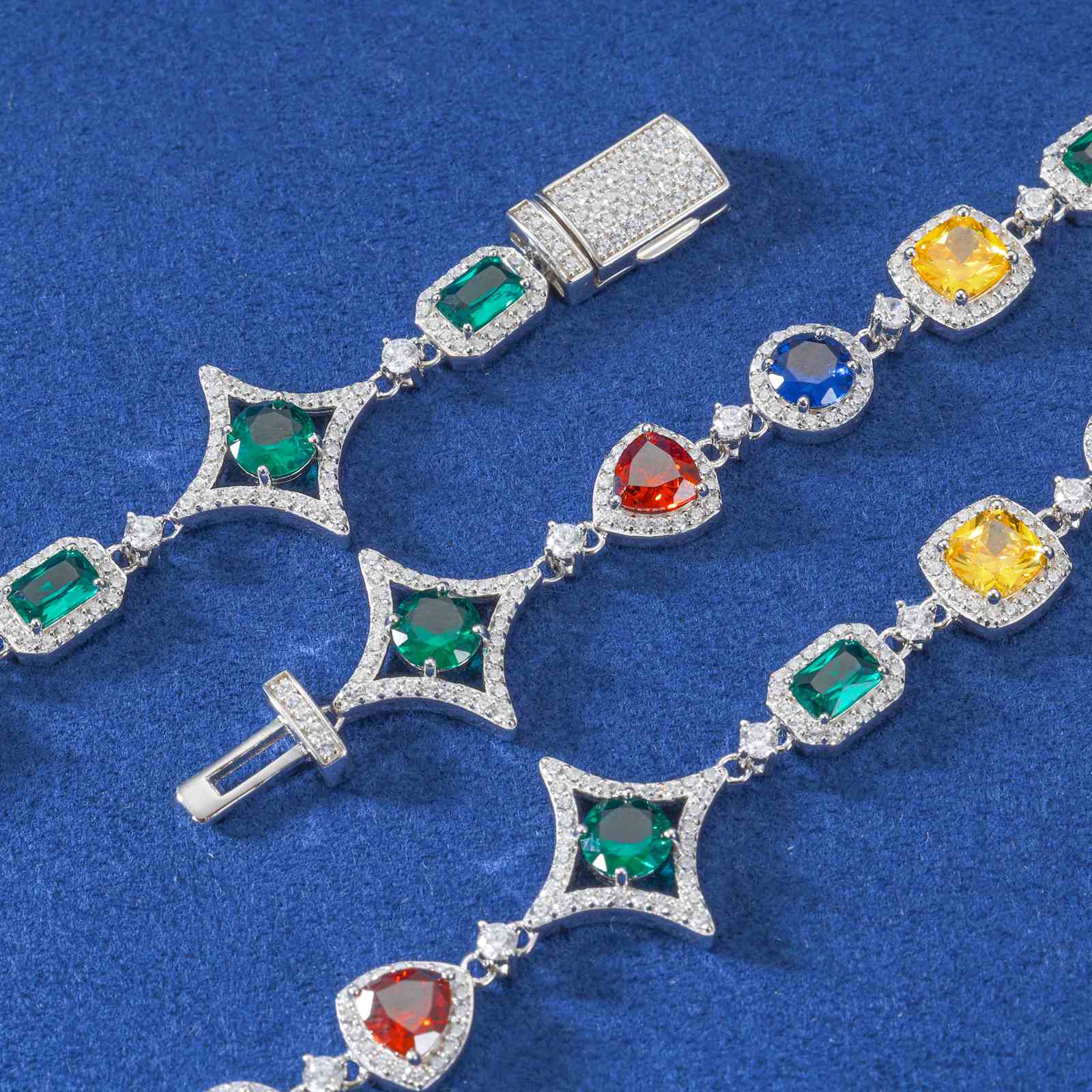 Macro view of reinforced tungsten carbide icebox clasp with engraved brand logo, securing the moissanite and zirconia tennis chain.