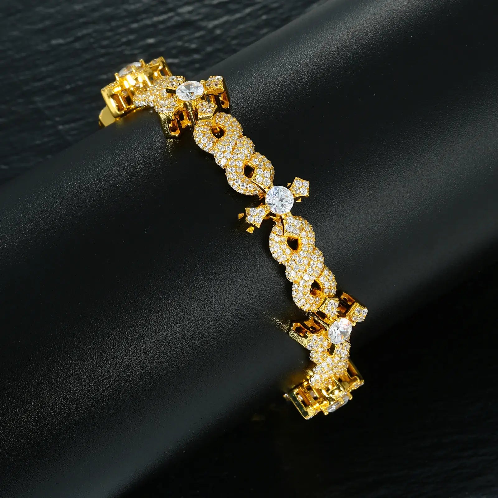Close-up: Gold infinity and cross links - 78 VVS moissanites handset in sacred patterns | Salt-resistant craftsmanship