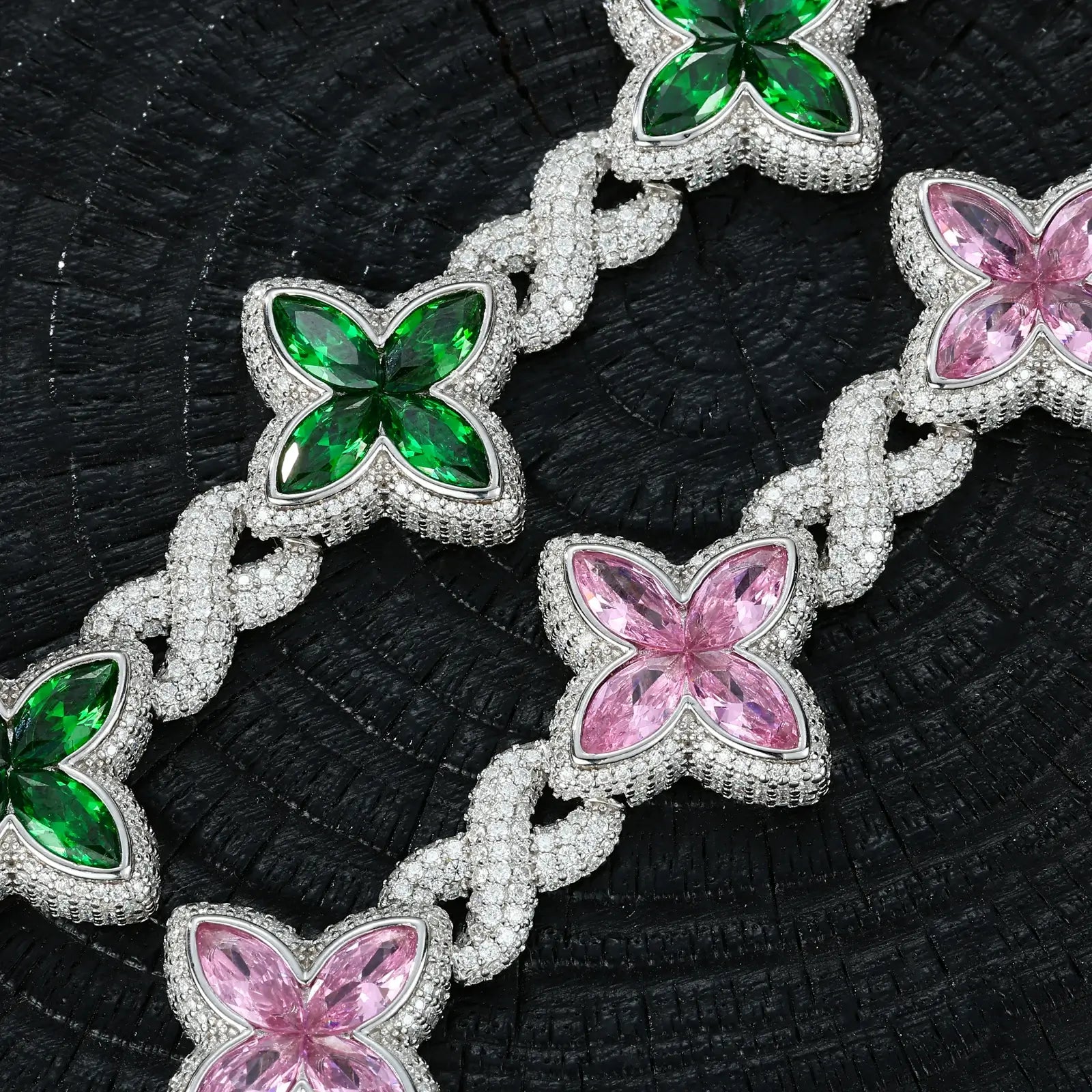 Extreme close-up: Green and pink zircon clovers with moissanite halos | VVS stone clarity on S925 silver