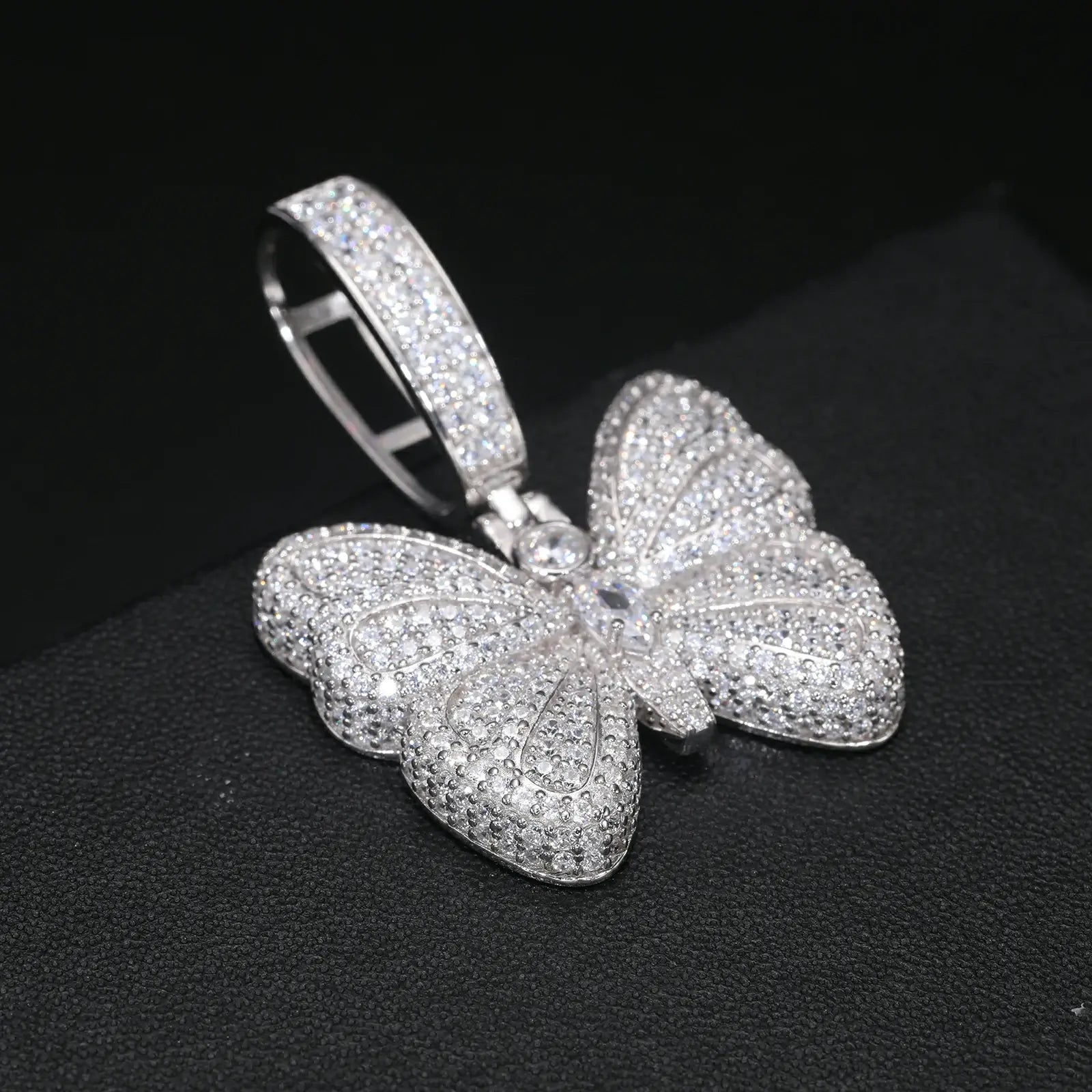 Profile close-up: 3D textured wings on butterfly pendant - VVS moissanite scales | Salt-resistant S925 craftsmanship