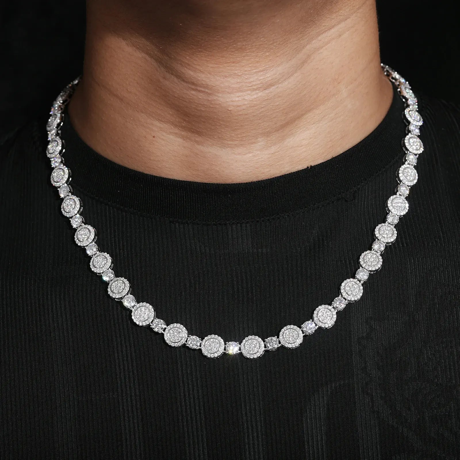 Male model wearing 9mm white gold moissanite coin tennis chain - 925 sterling silver necklace for men with diamond alternative stones