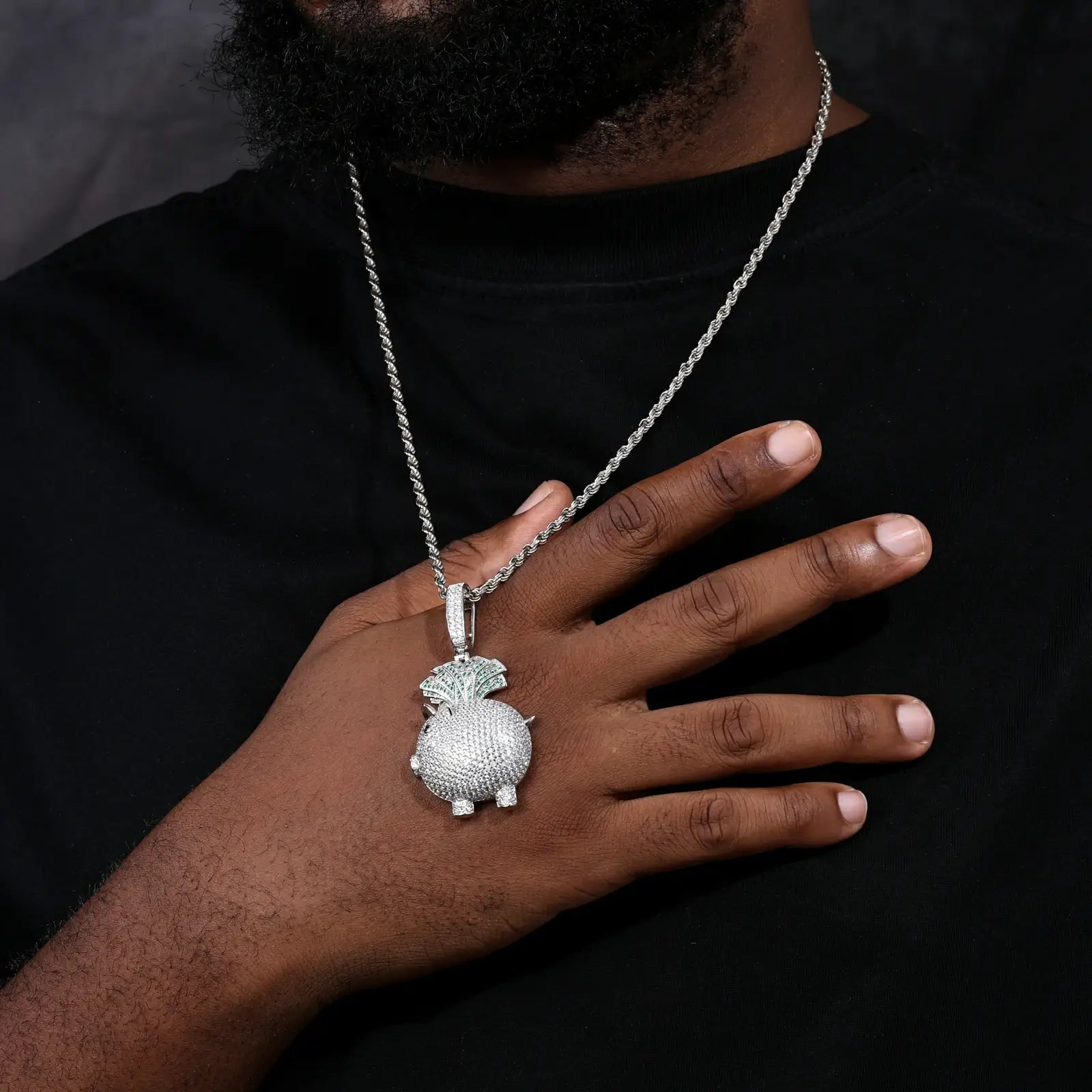 African American man front-view with S925 piggy pendant - moissanite-studded body on twisted chain | Hypoallergenic wealth talisman