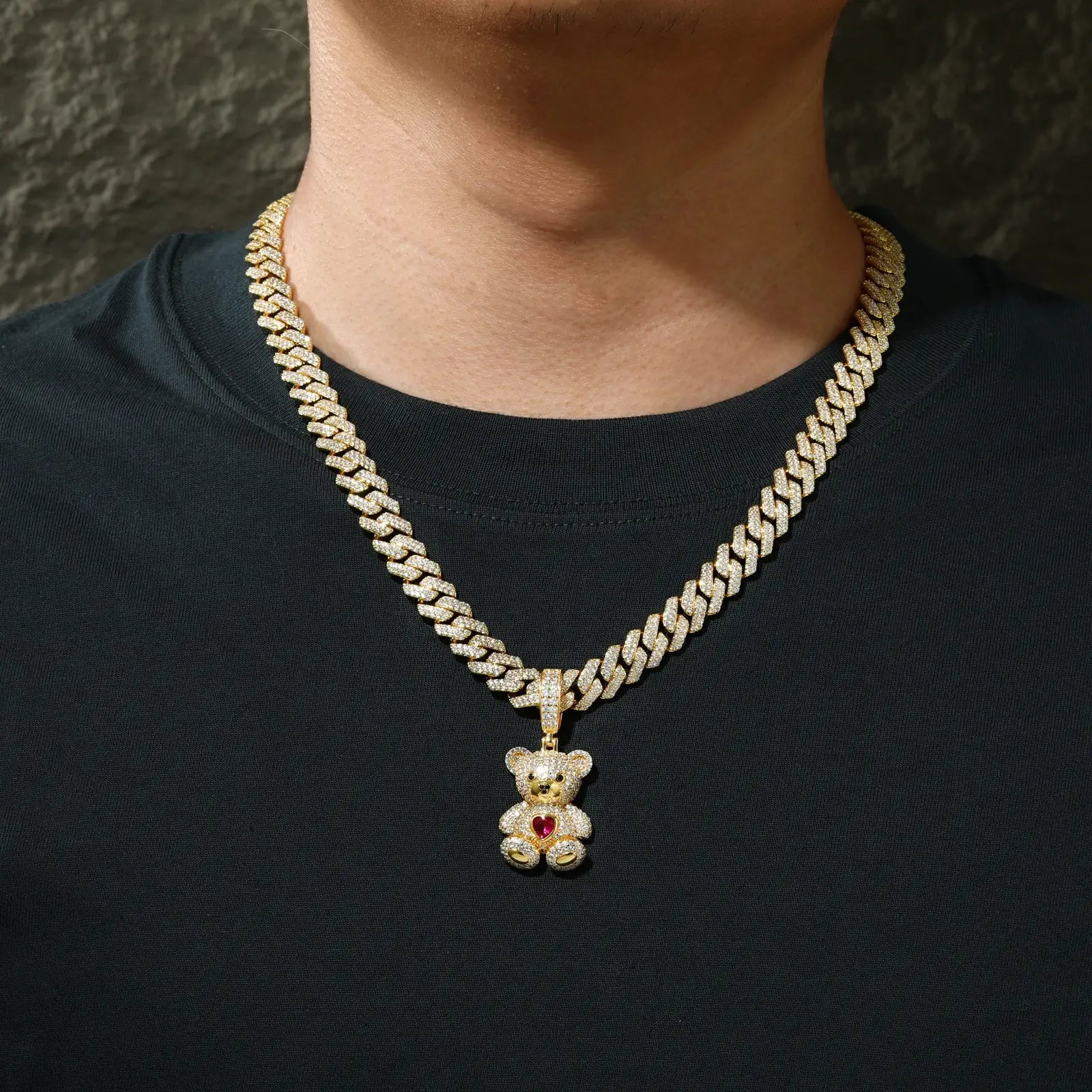 Male fashion model wearing gold sweetheart bear pendant on Cuban chain - luxury S925 silver moissanite statement jewelry